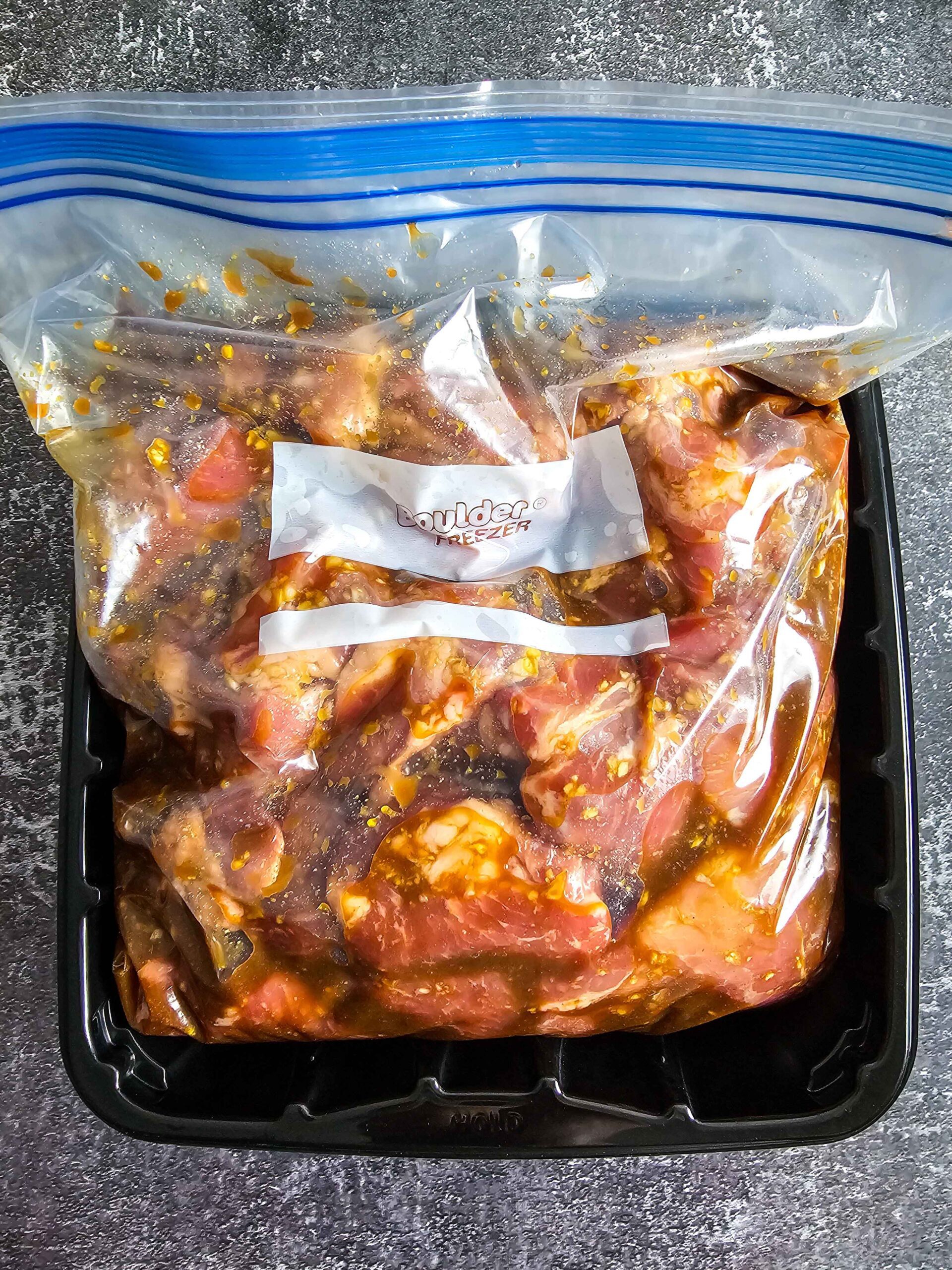 POUR MARINATE OVER THE PORK IN A ZIP TOP BAG