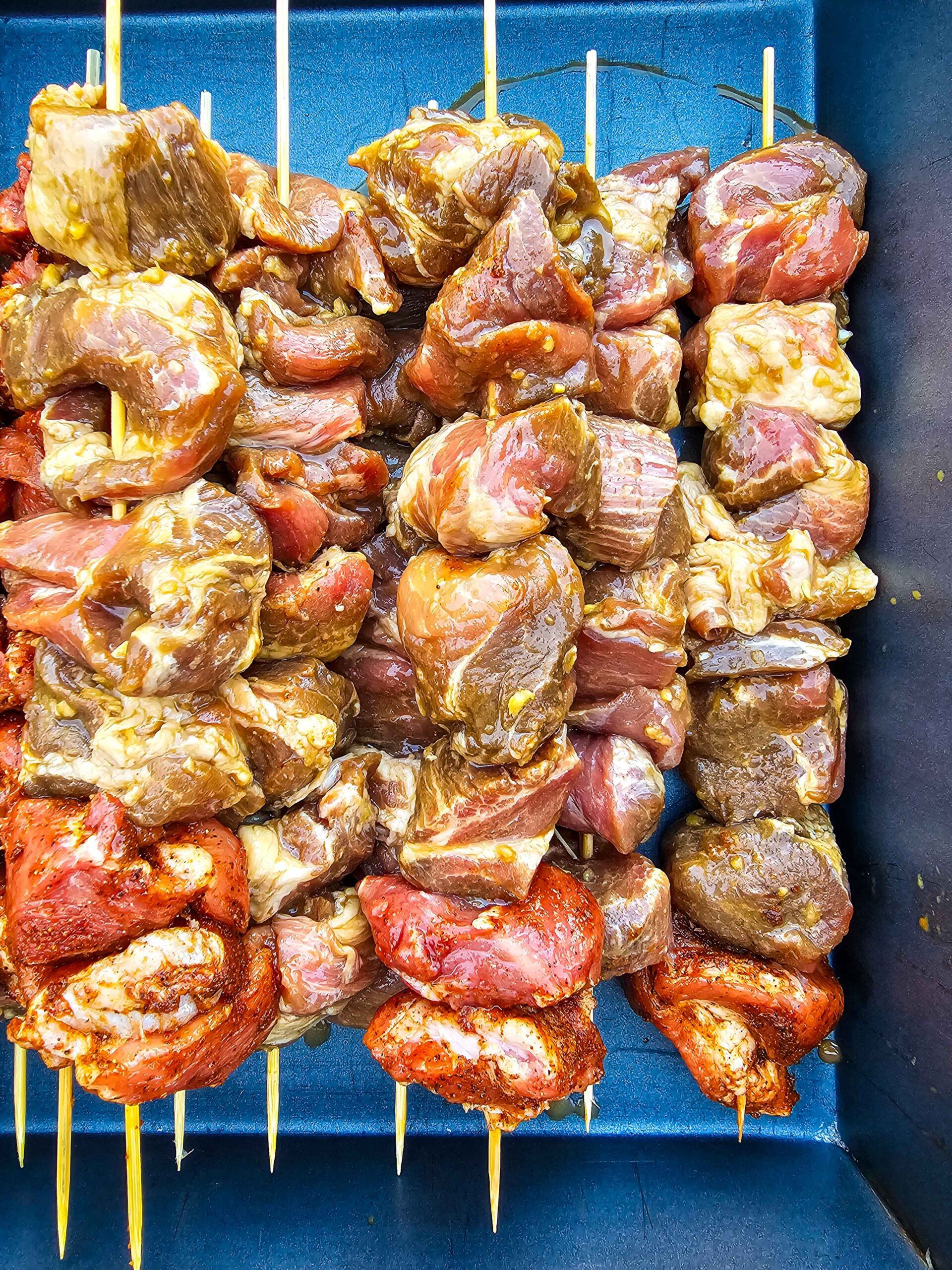 PLACE THE PORK ON SKEWERS