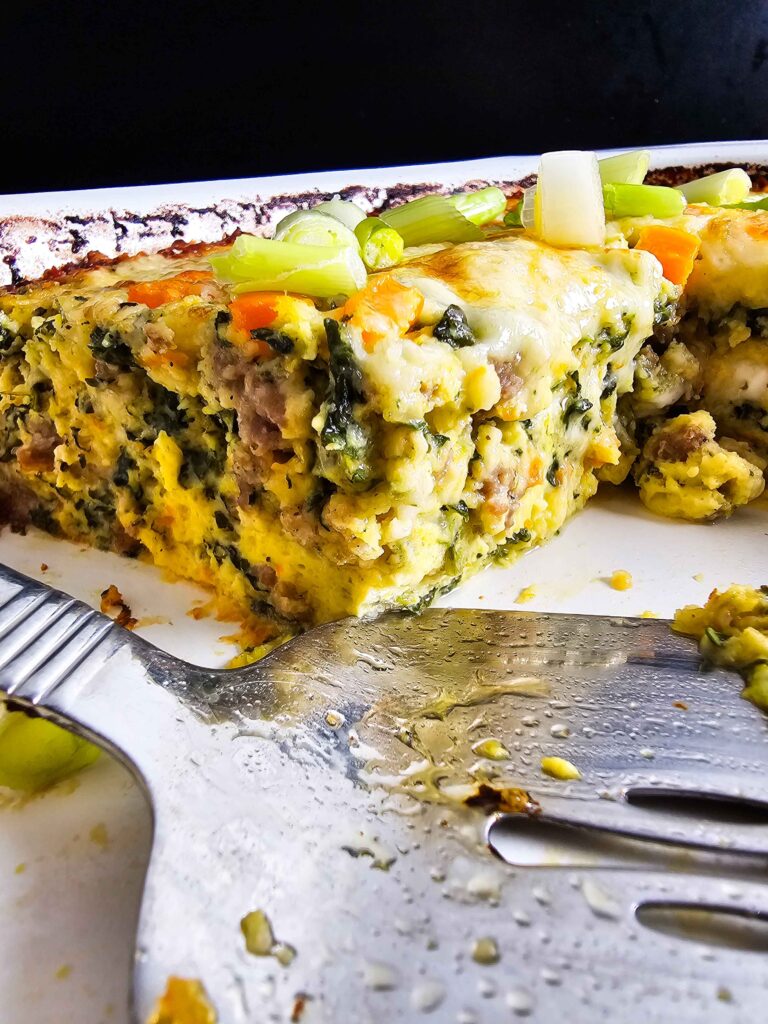 SIDE VIEW OF THE CASSEROLE IN THE PAN SLICES TAKEN OUT OF THE PAN