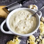 CREAMY WHITE SAUCE IN A SMALL BOWL.