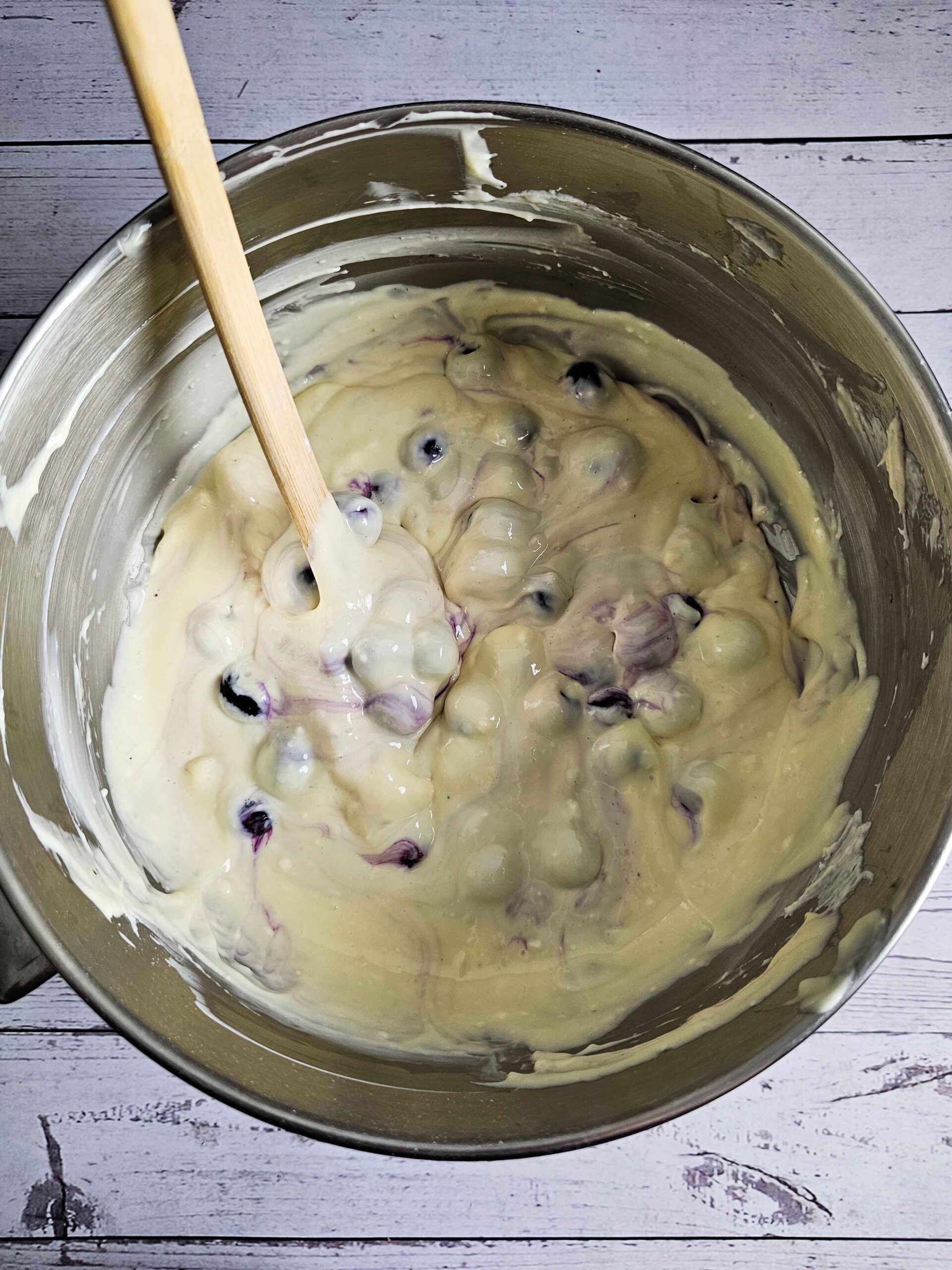 FOLD IN THE BLUEBERRIES INTO THE CHEESECAKE BATTER