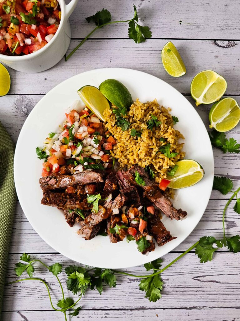 PLATED CARNE ASADA WITH RICE AND PICO DE GALLO