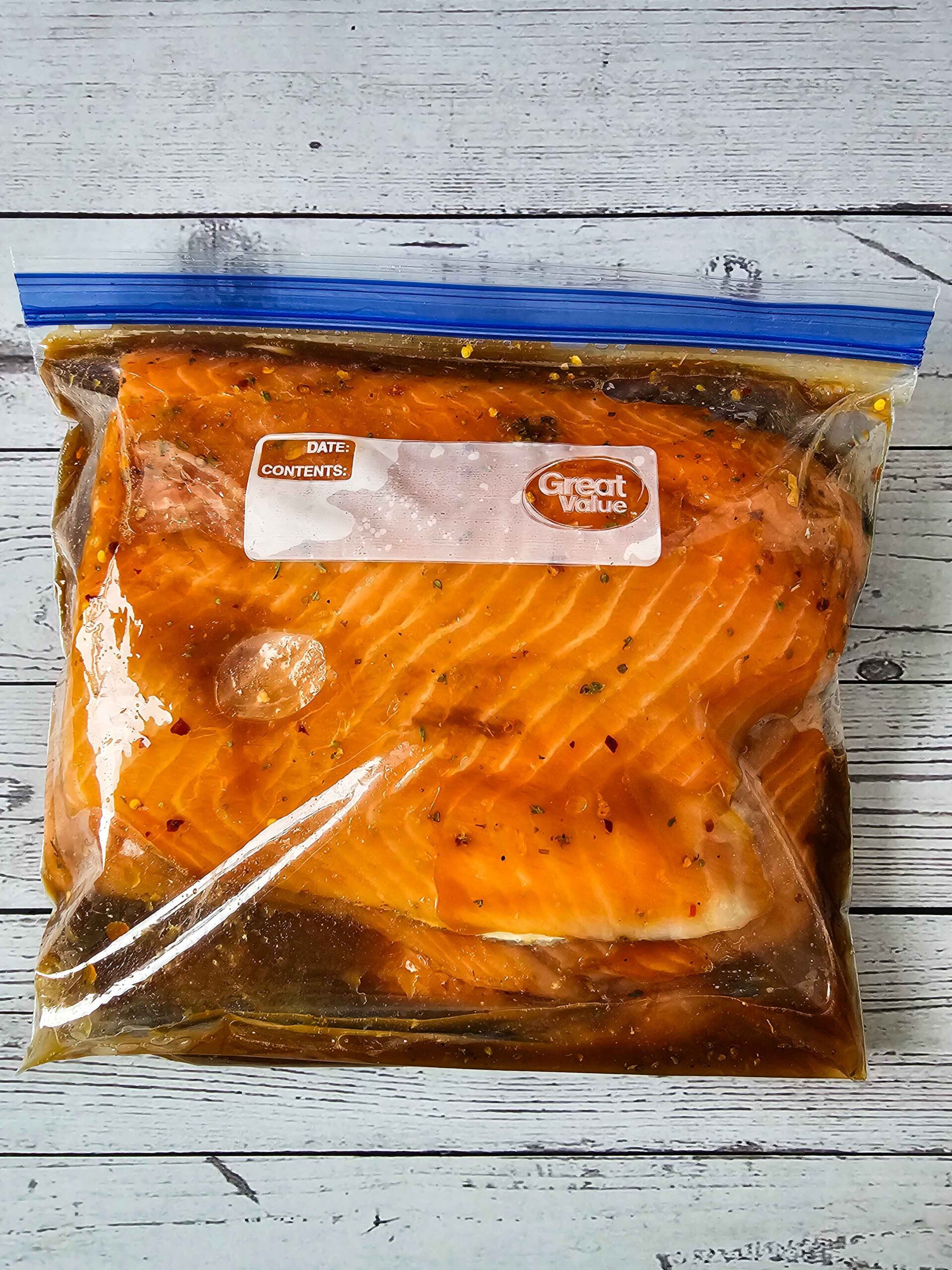 POUR THE MARINATE OVER THE SALMON IN A ZIP TOP BAG