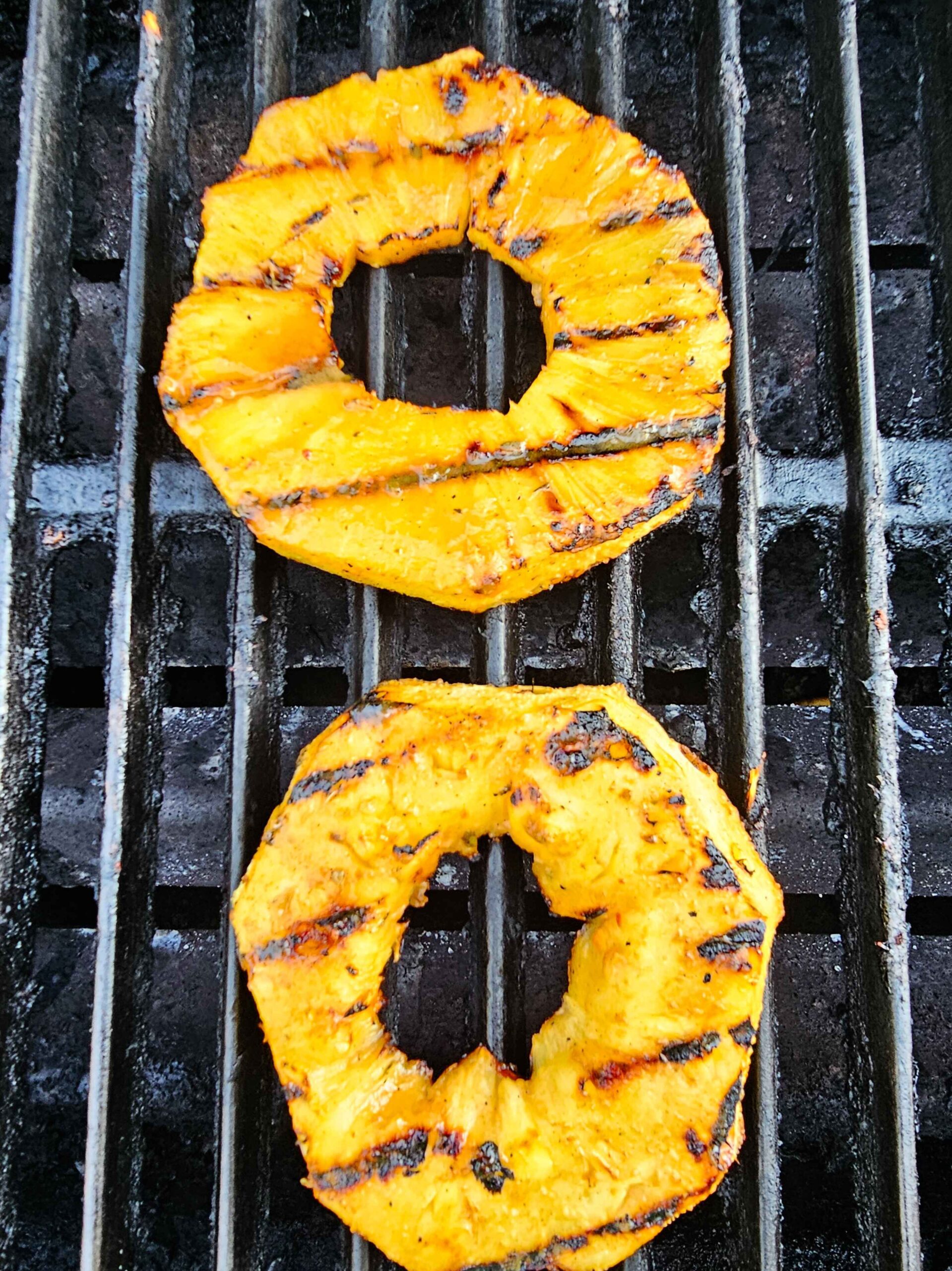 PLACE THE PINEAPPLE ON THE GRILL AND CARAMELIZE EACH SIDE