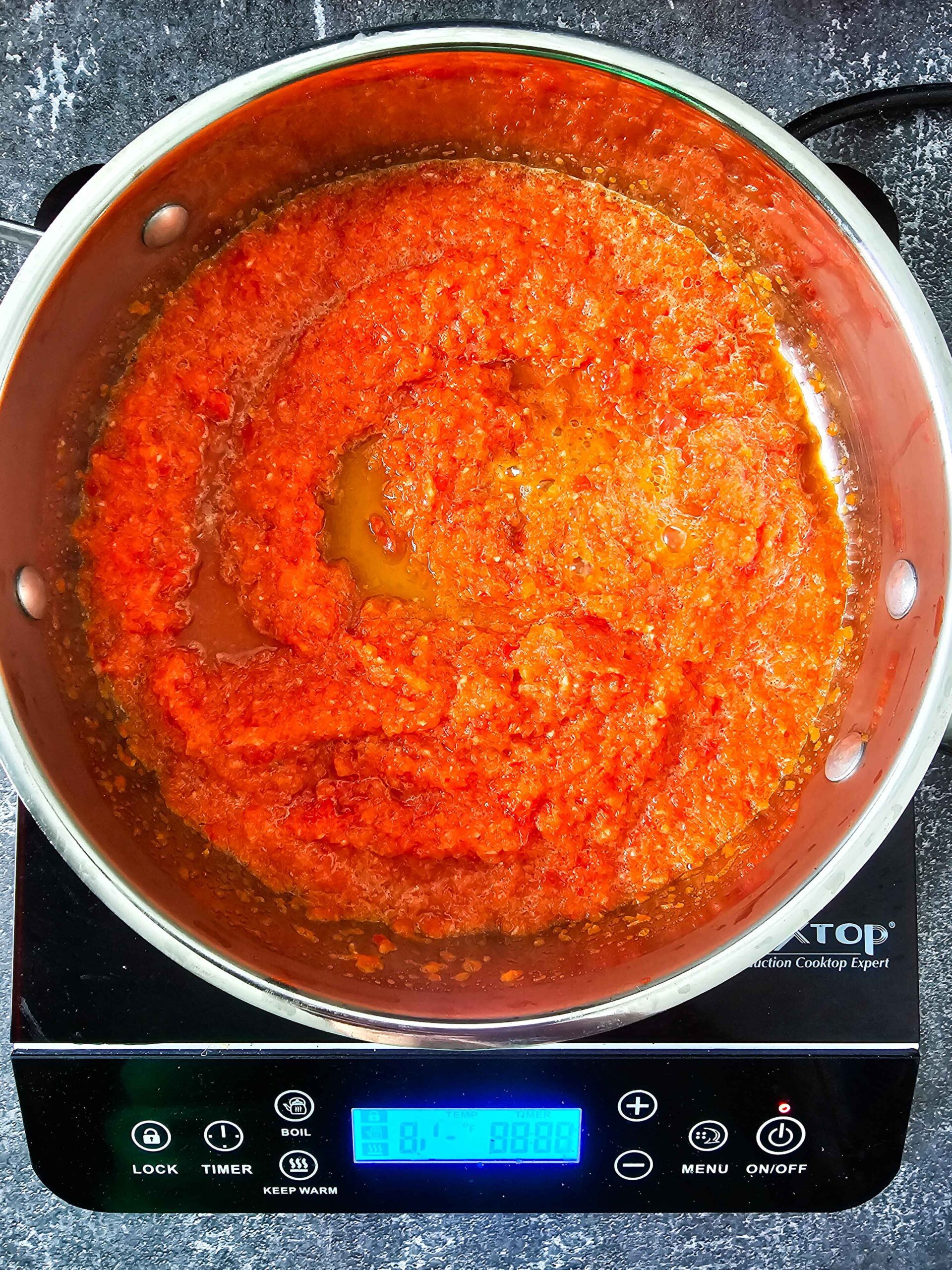 SAUTE THE RED BELL PEPPER, ONION AND GARLIC.