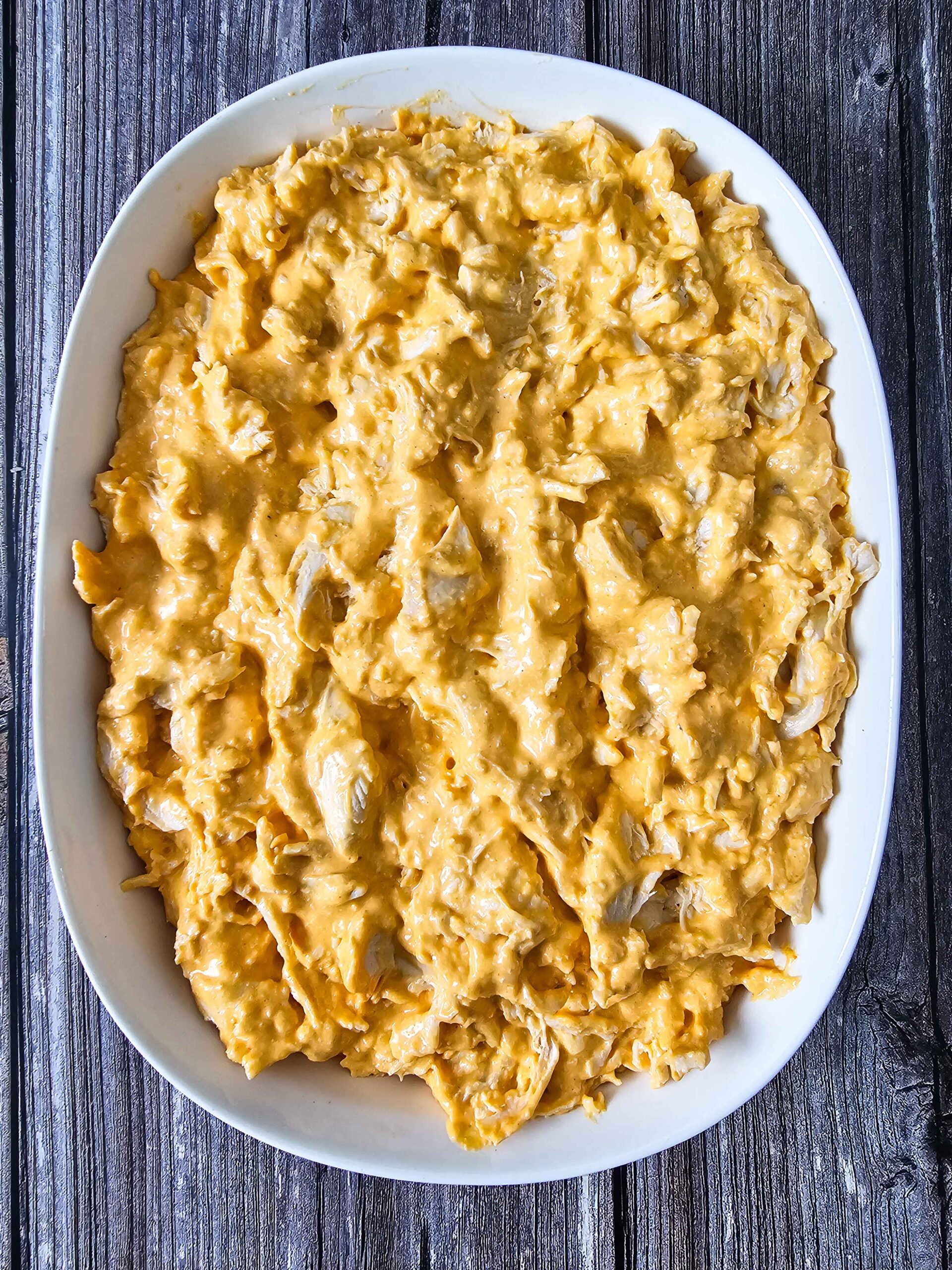 SPREAD THE BUFFALO RANCH CHICKEN DIP IN A BAKING DISH