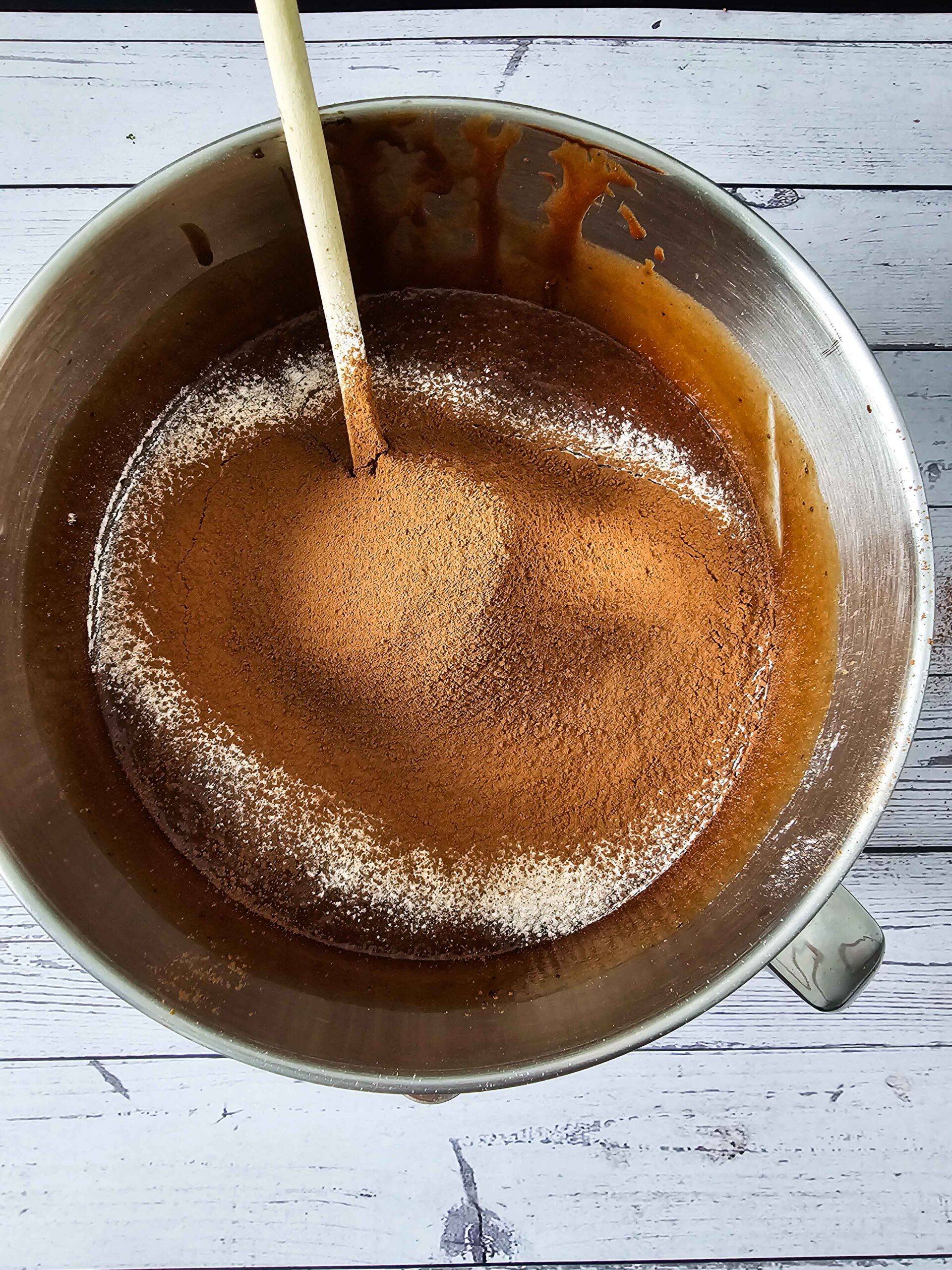 SHIFT THE FLOOR INTO THE WET BATTER AND FOLD THE FLOUR IN