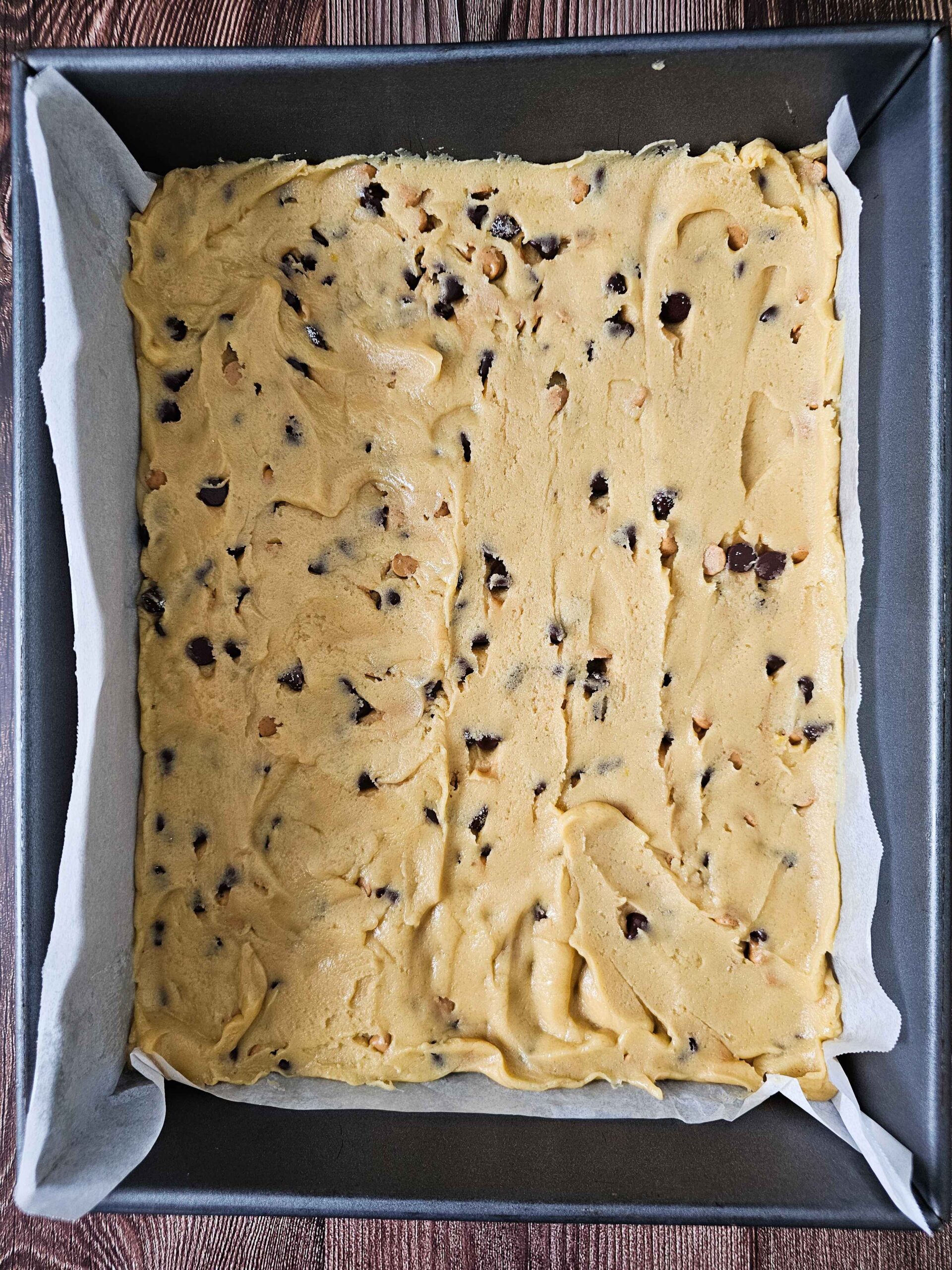 SPREAD THE DOUGH INTO A 11 X14 BAKING PAN