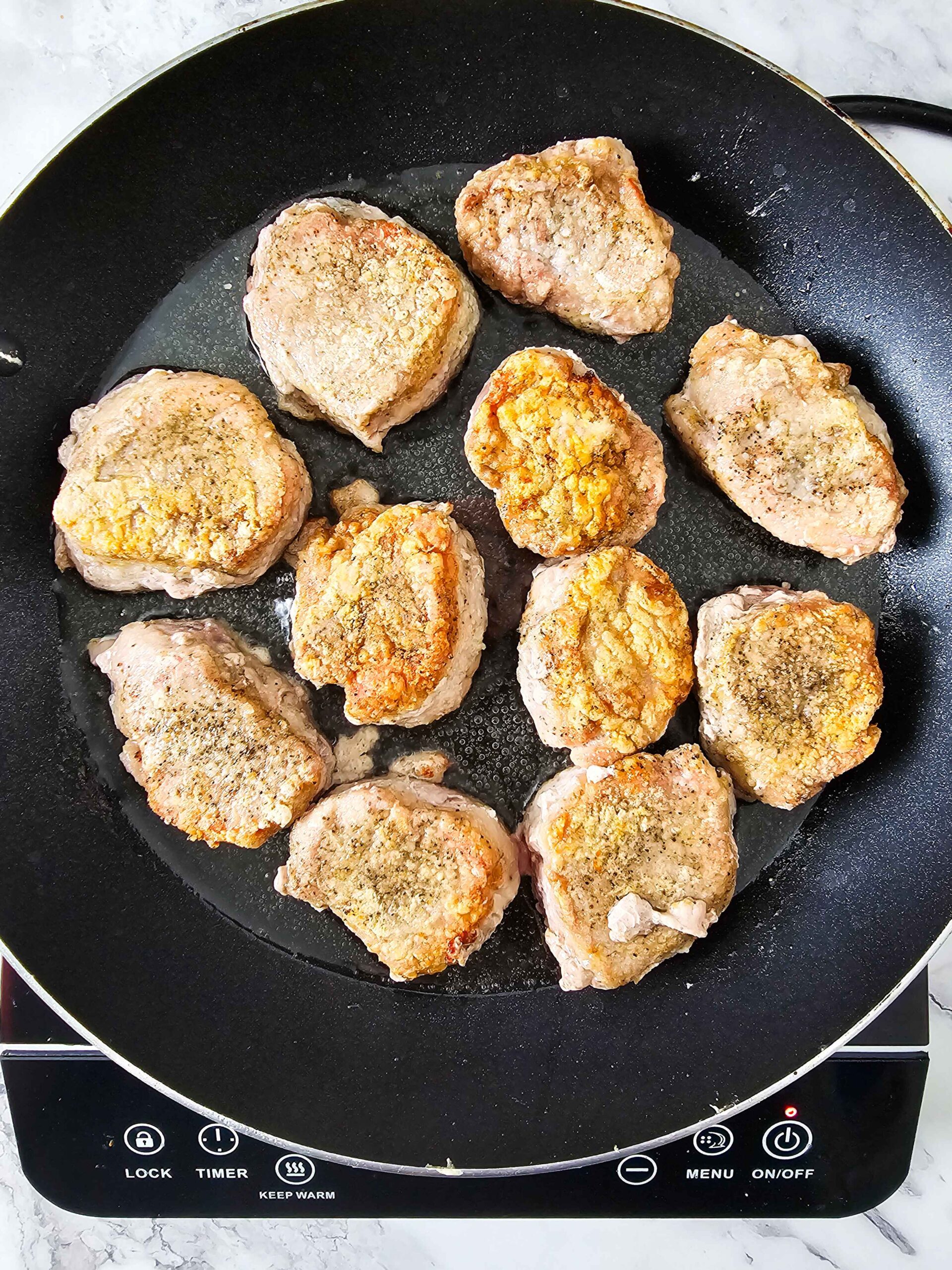 SEAR THE PORK TENDERLOIN MEDALLIONS UNTIL GOLDEN.