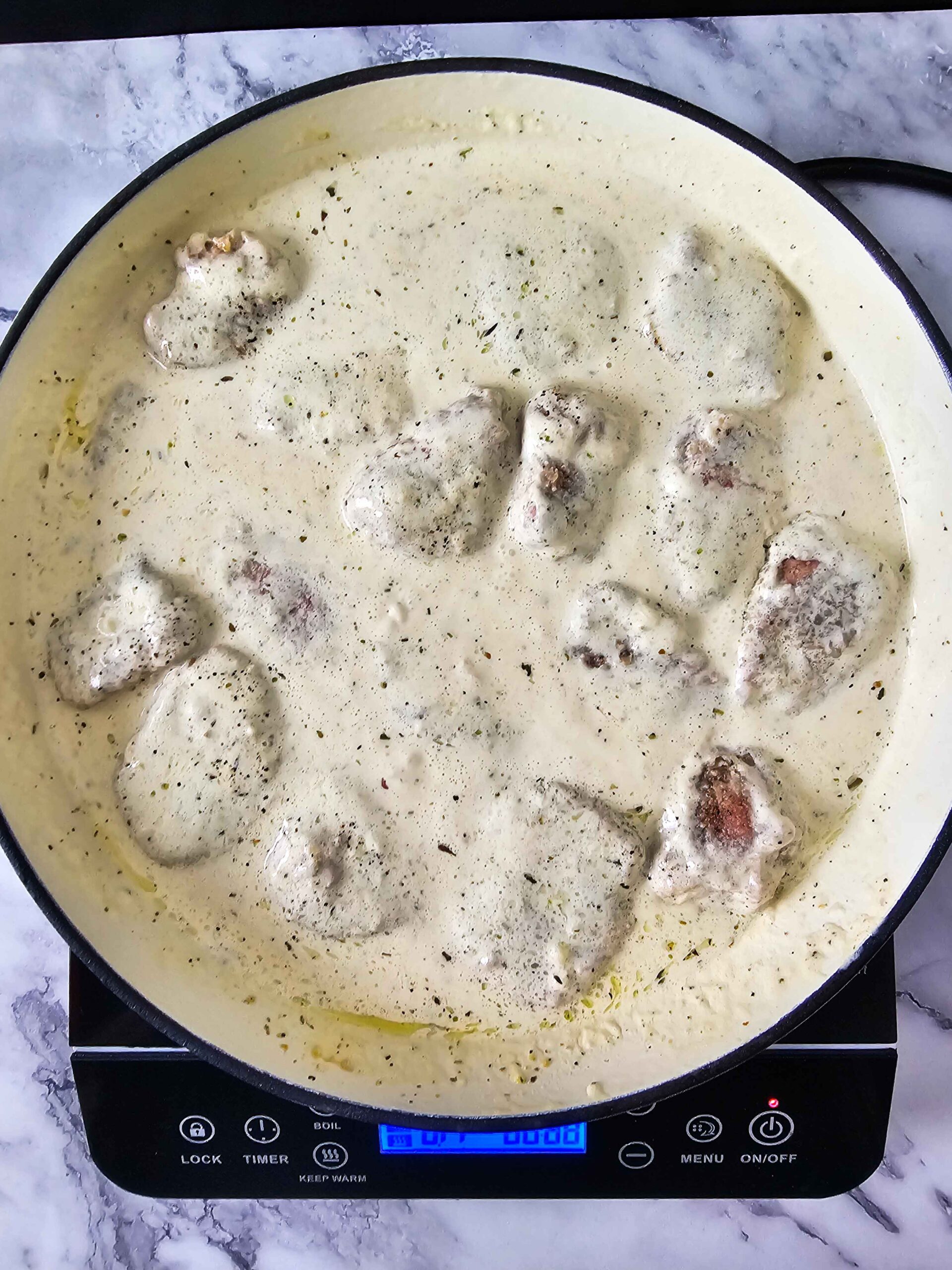 ADD THE PORK TENDERLION BACK TO THE SKILLET AND SIMMER FOR 5 MINUTES