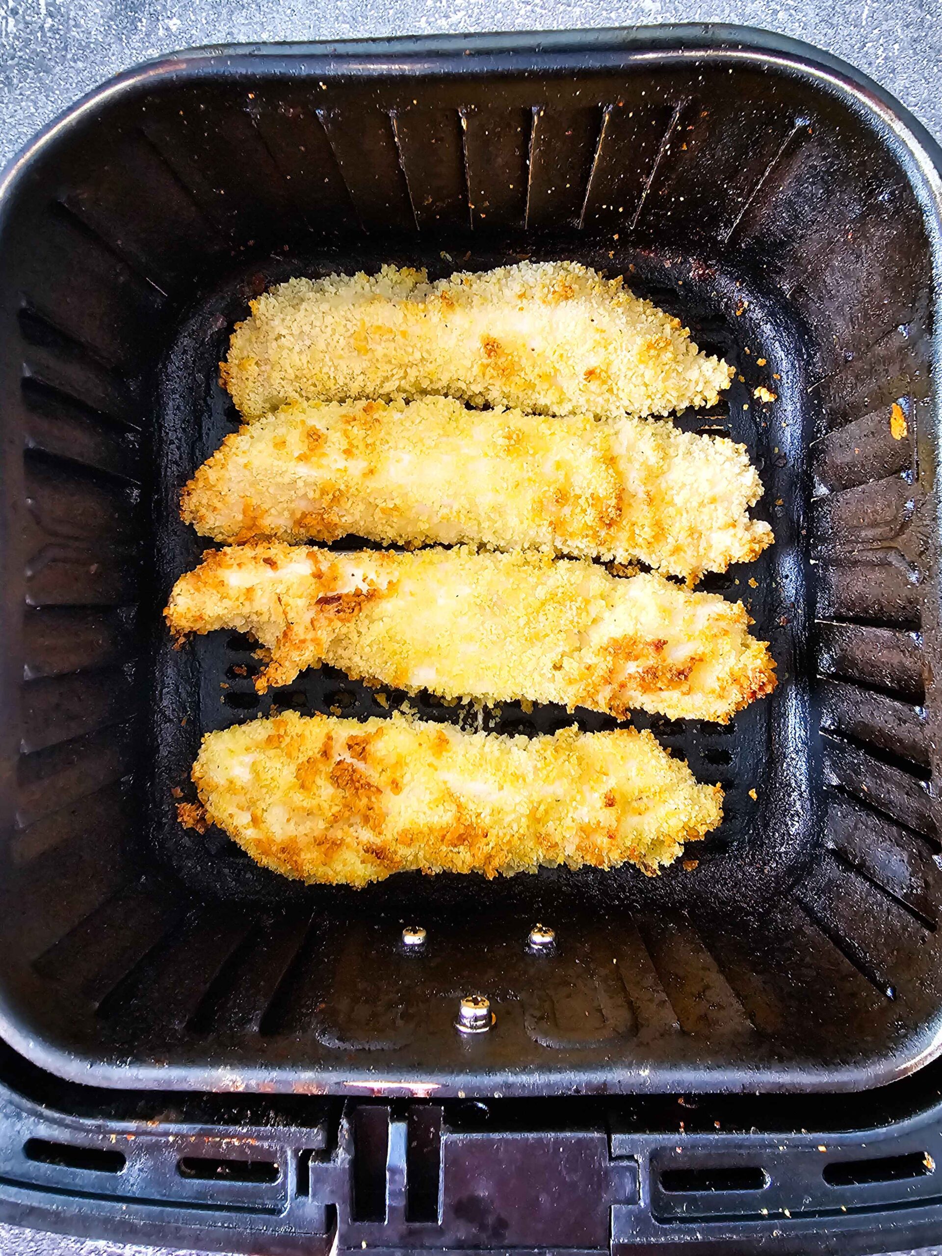 FLIP THE CHICKEN TENDERS IN THE AIR FRYER BASKET HALF WAY THROUGH COOKING