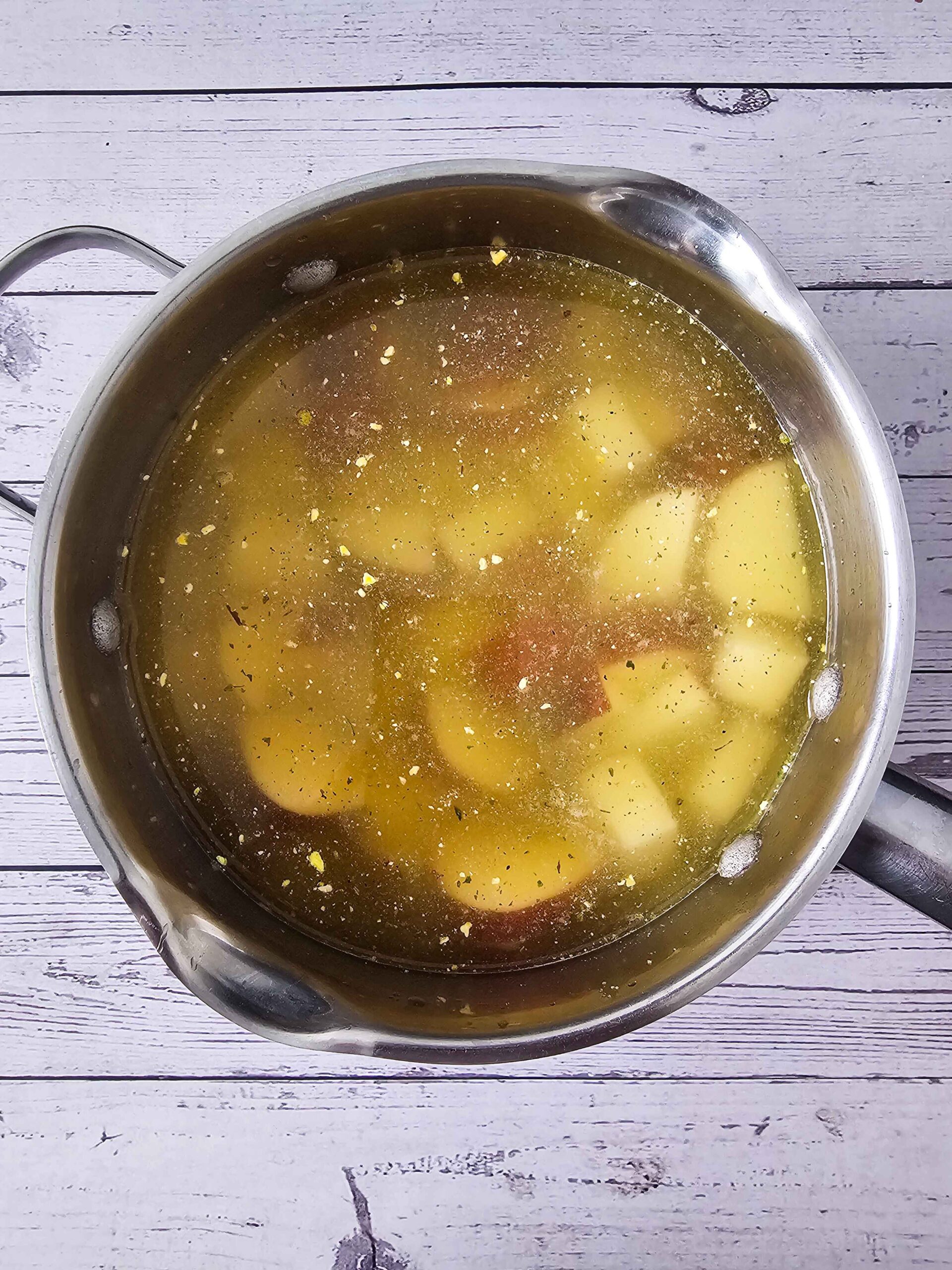 BOIL THE RED POTATOES IN CHICKEN STOCK