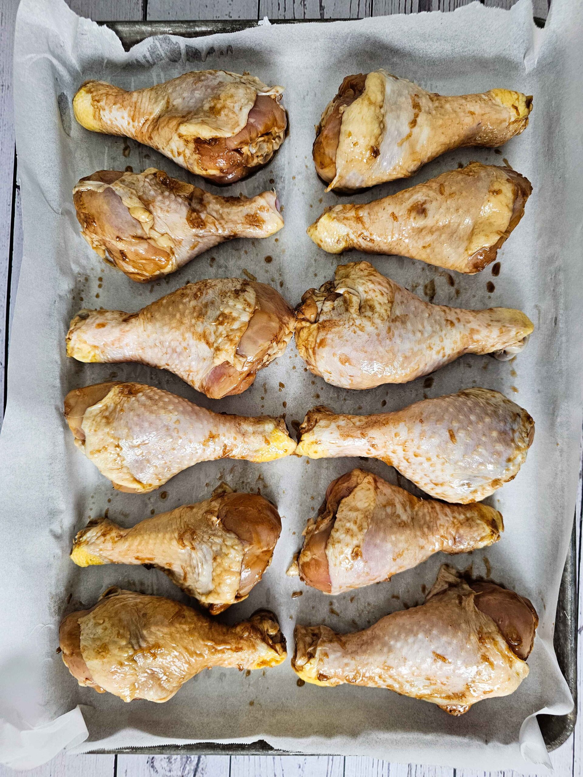 ARRANGE THE CHICKEN LEGS ON A PREPARED BAKING SHEET