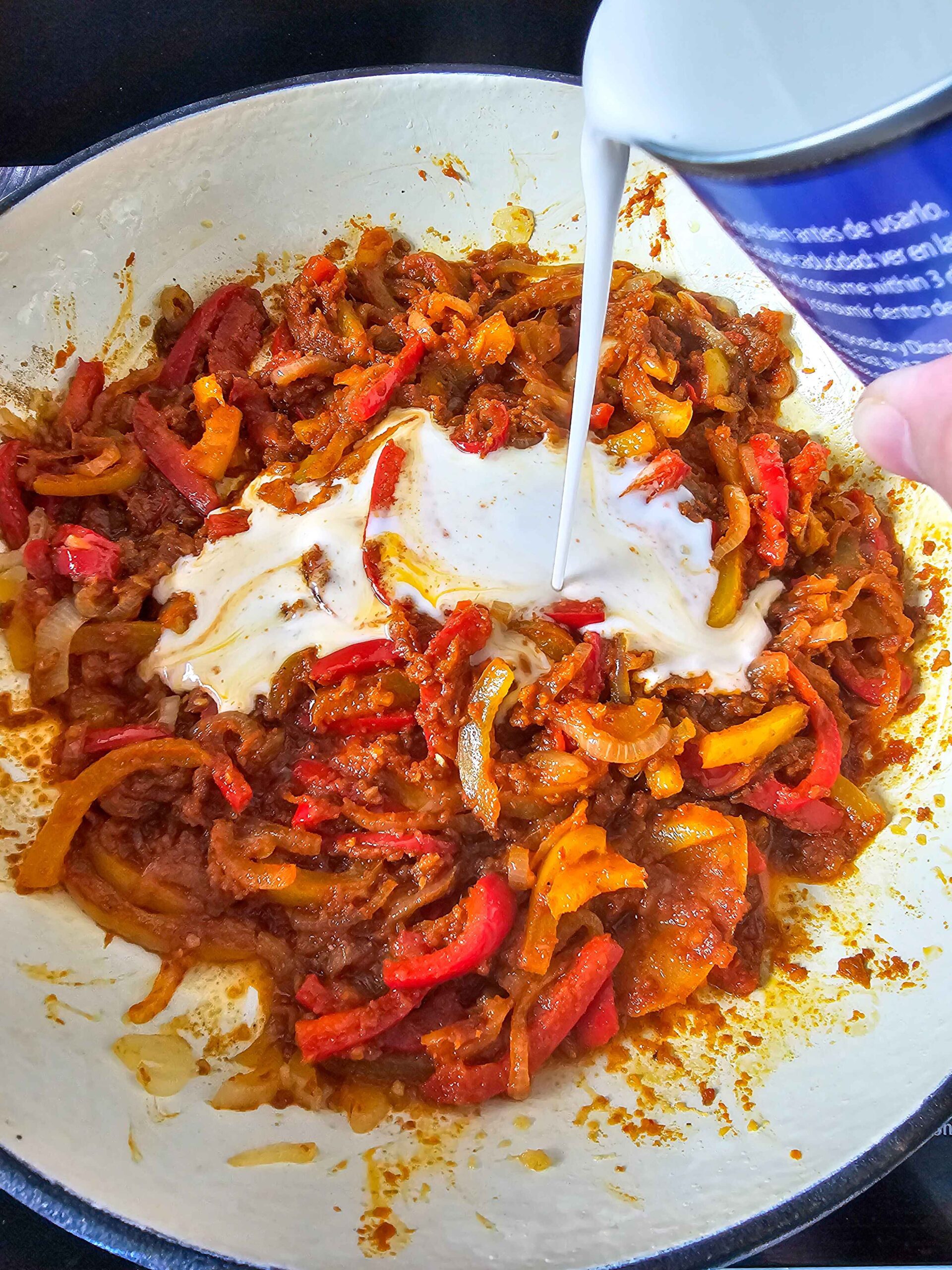 ADD THE COCONUT MILK TO THE SKILLET