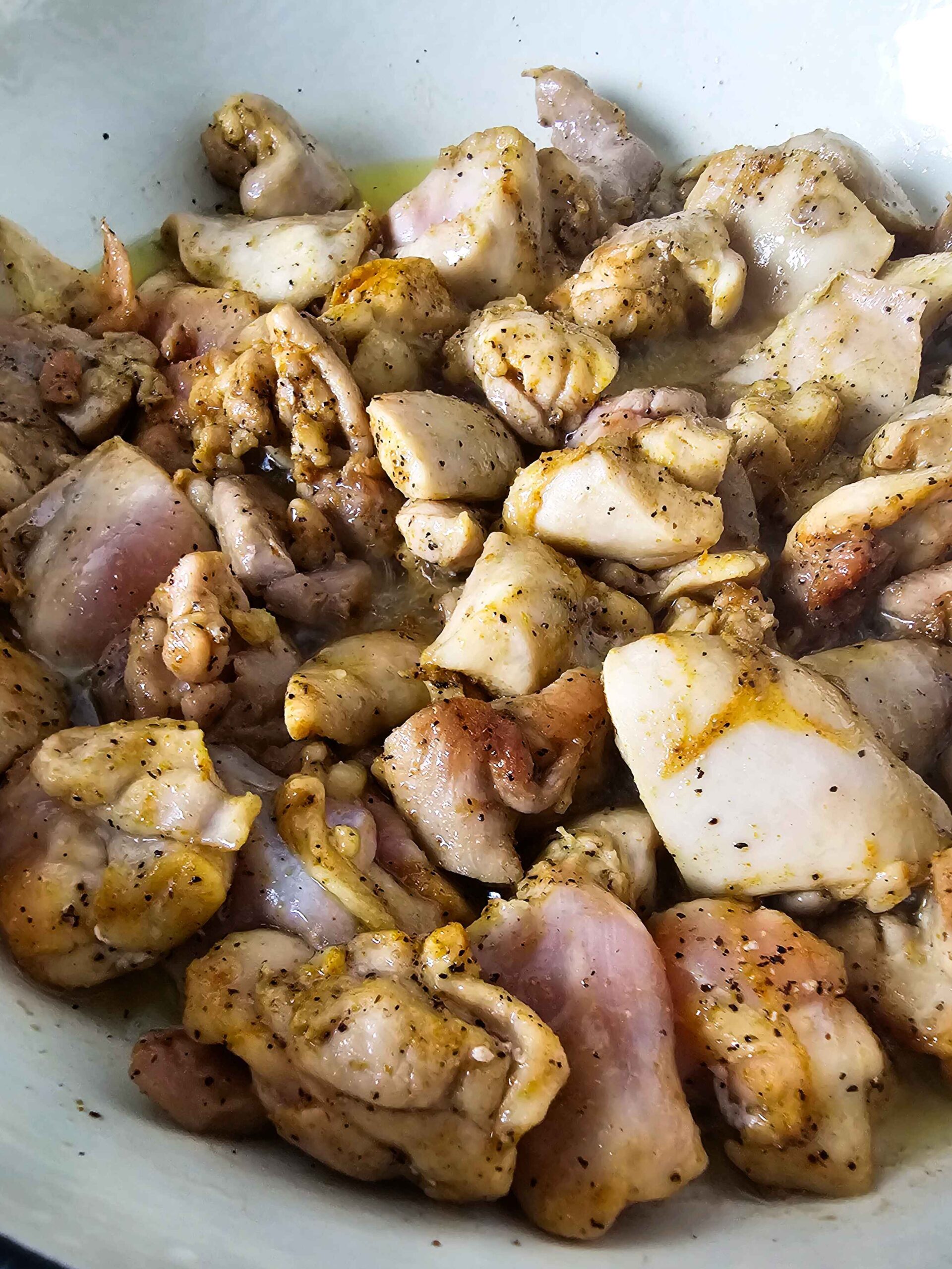 SEAR THE CHICKEN THIGHS IN COCONUT OIL