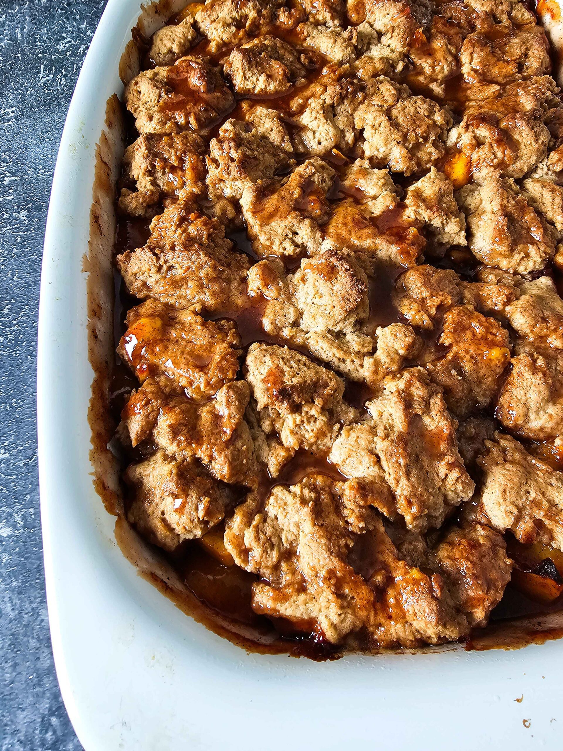 BAKE THE PEACH COBBLER UNTIL ITS GOLDEN BROWN