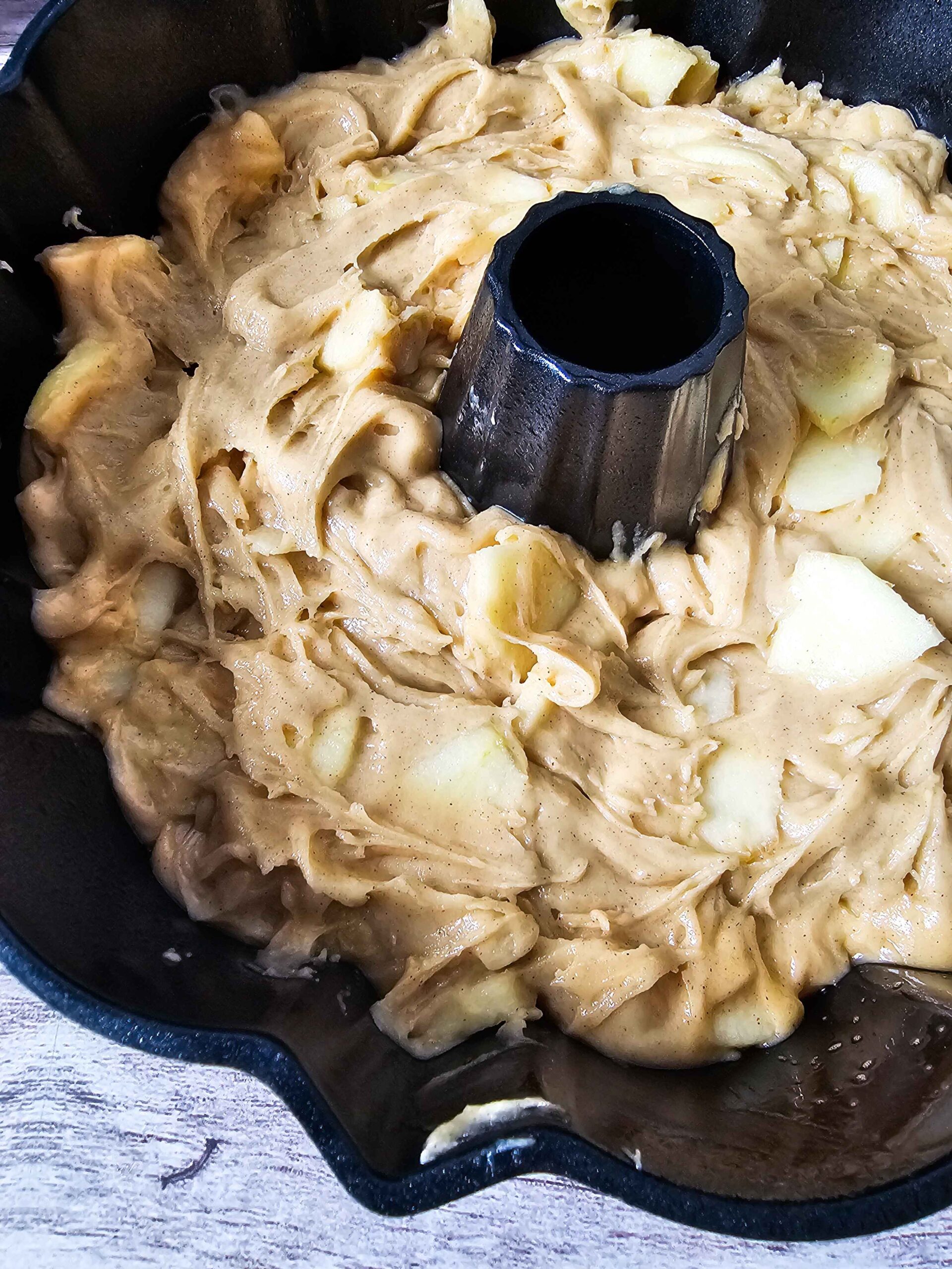 APPLE BUNDT CAKE POURED INTO THE BUNDT CAKE PAN