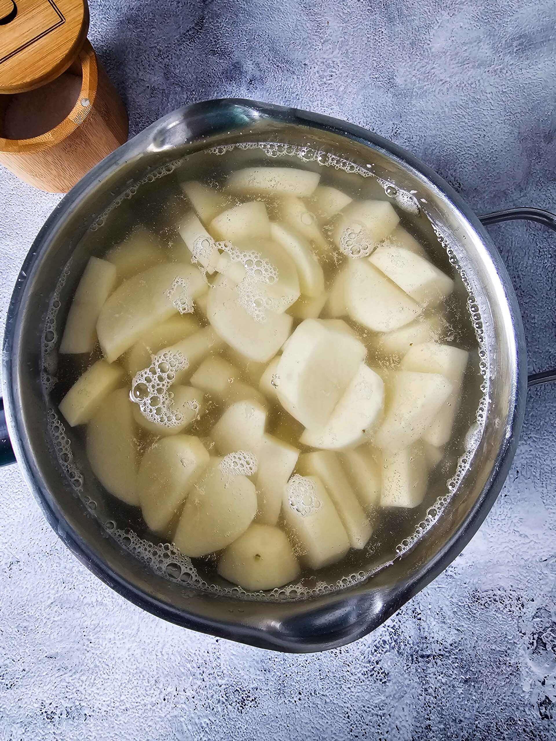 BOIL THE PEELED AND CUBED POTOTOES