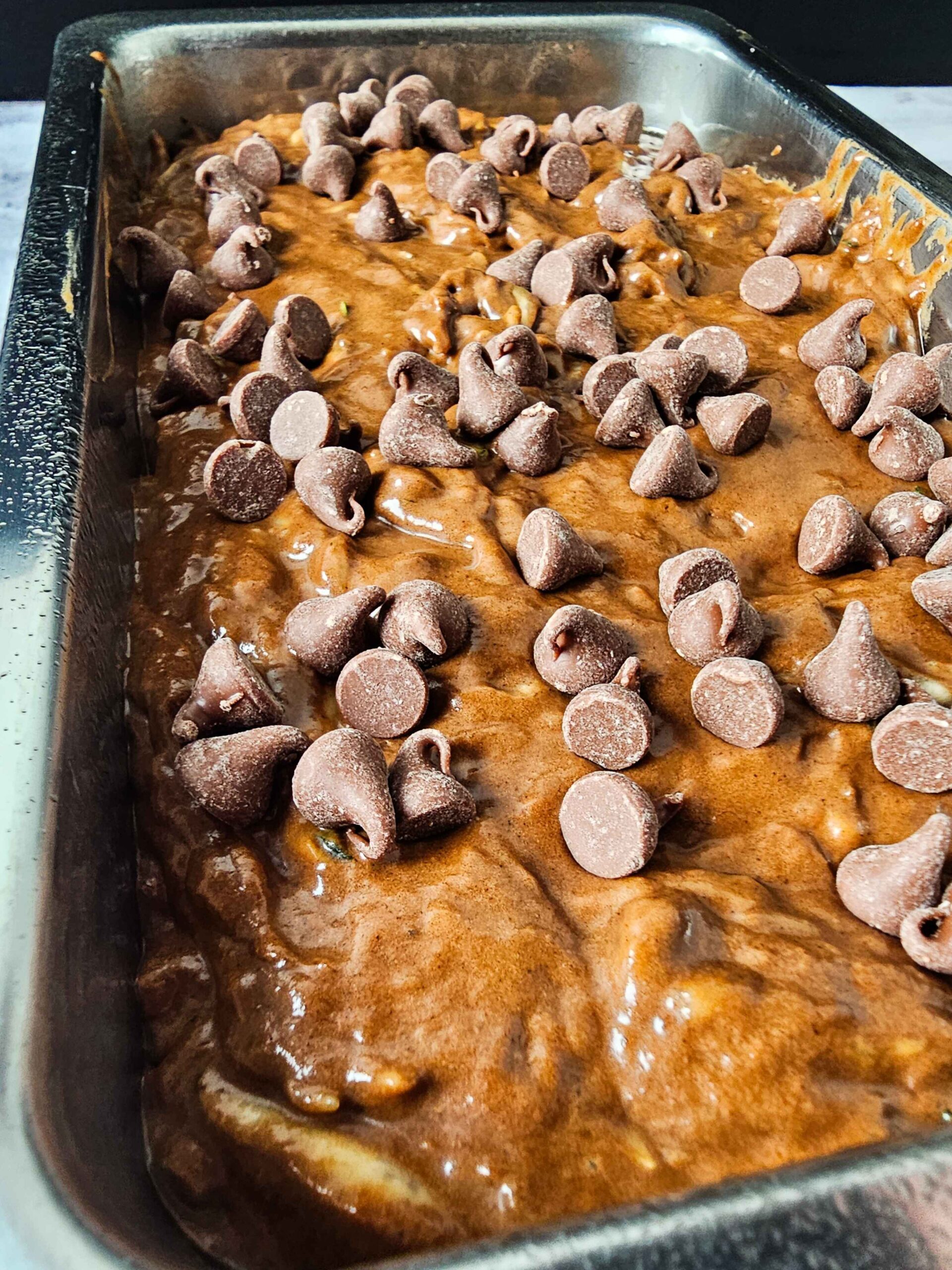 POUR THE BATTER INTO A LOAF PAN