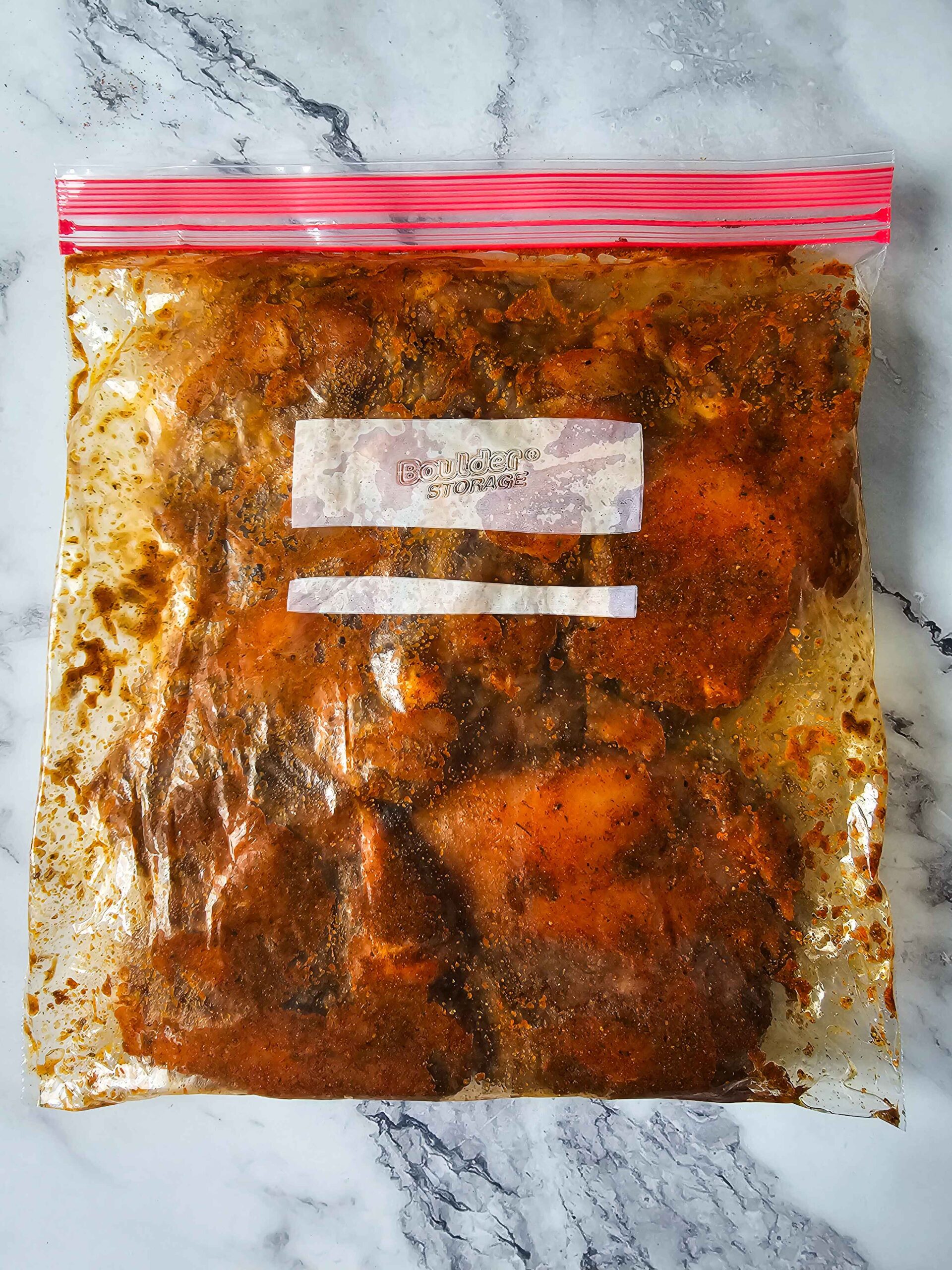 COMBINE ALL THE SPICES AND COAT THE CHICKEN EVENLY -- TOSS IN A ZIP TOP BAG.