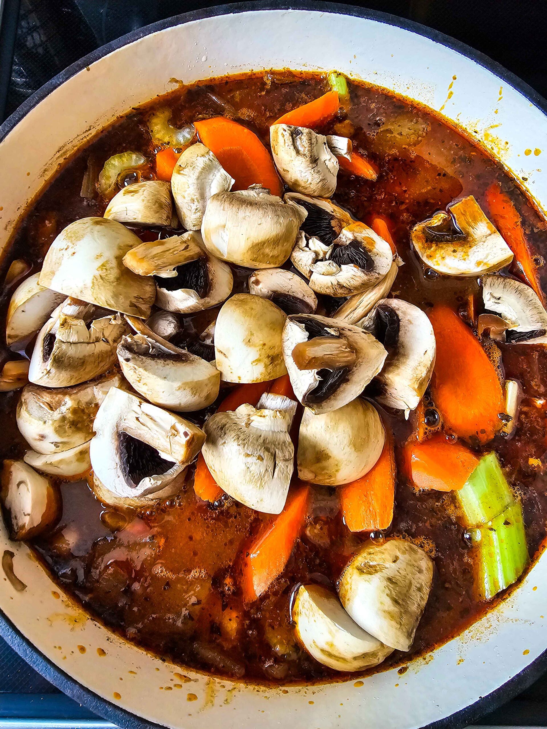 ADD THE BEEF BROTH AND VEGGIES