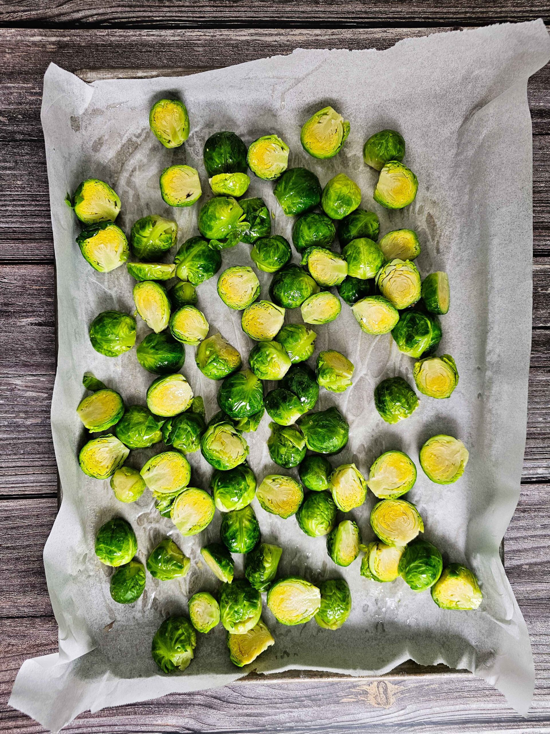 SPREAD THE CLEANED AND HALFED BRUSSELS SPROUTS ON A BAKING SHEET