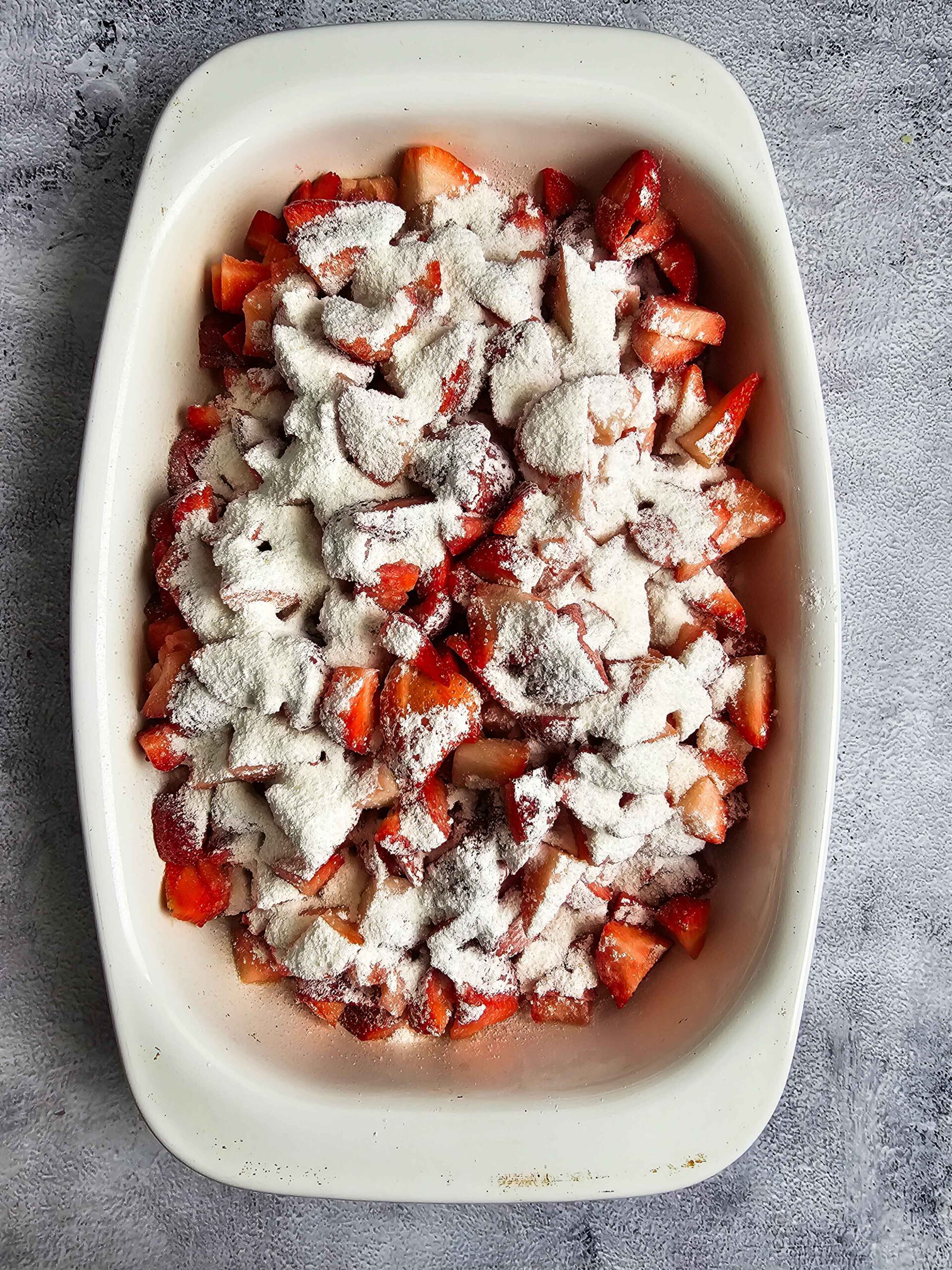 SLICED STRAWBERRIES SPRINKLED WITH CORNSTARCH AND SUGAR