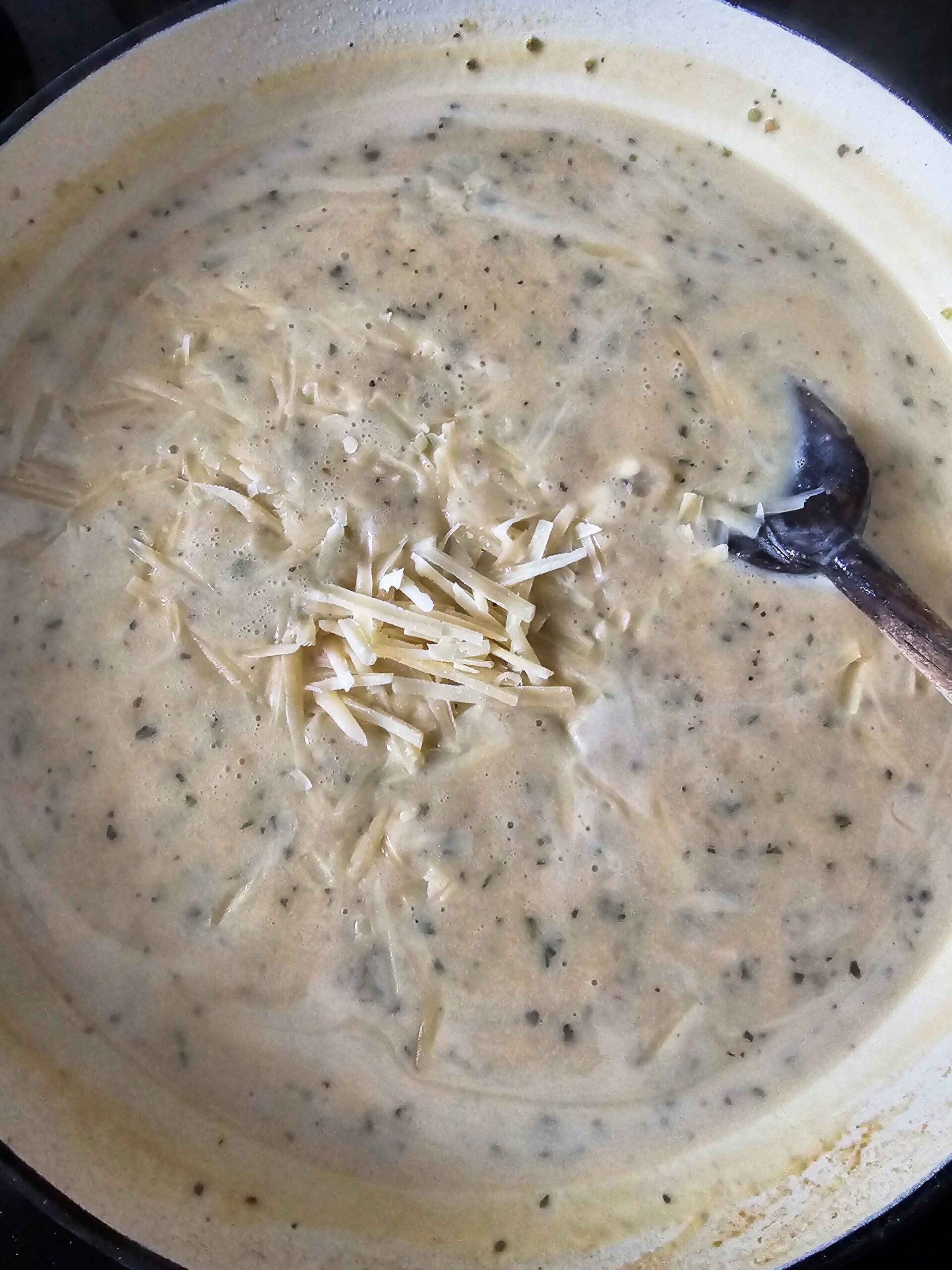 ADD THE SHREDDED PARMESAN AND LEMON JUICE TO THE SAUCE