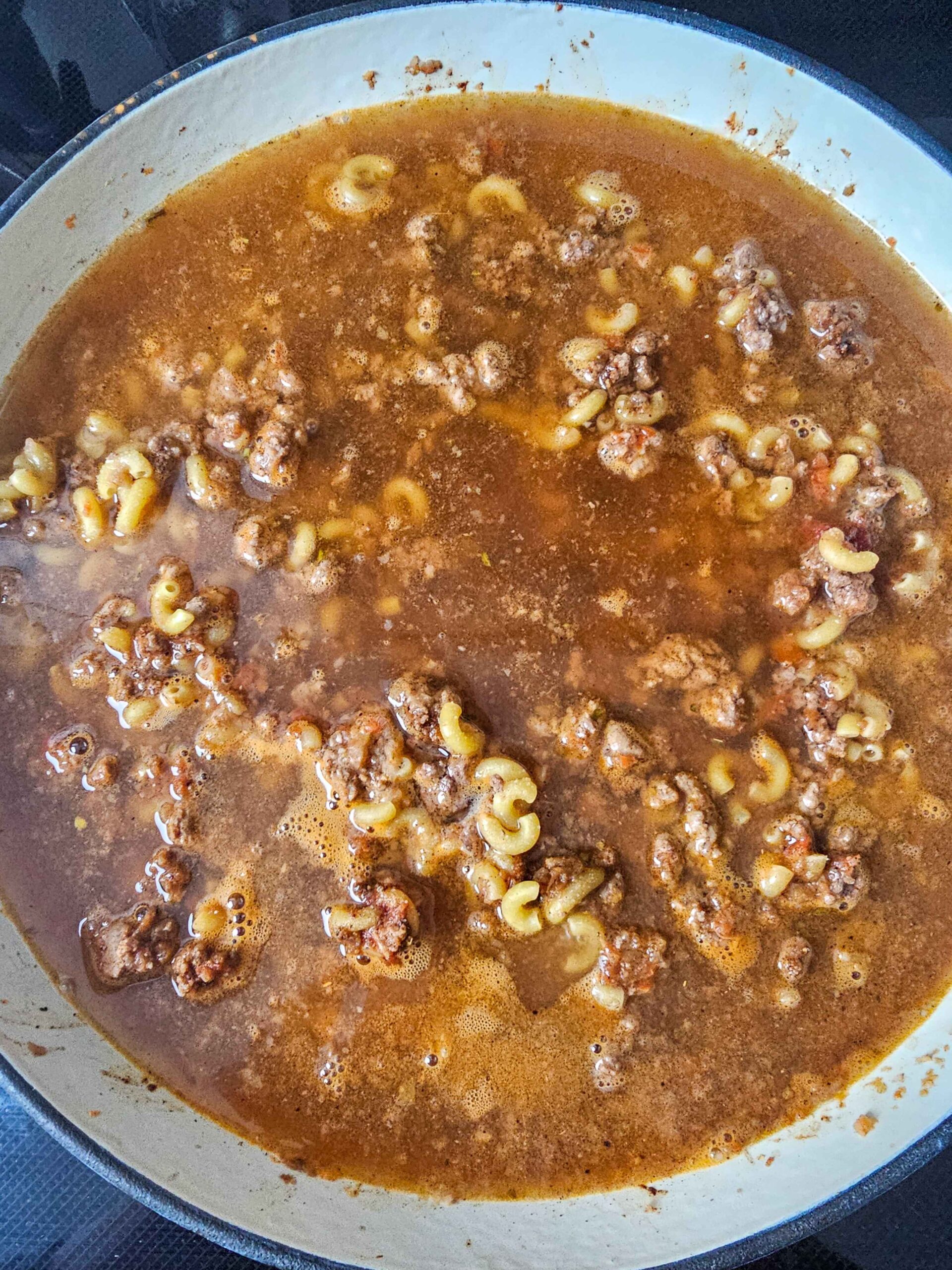 ADD PASTA, SEASONING AND LIQIUD AND SIMMER ON LOW FOR 10-15 MINUTES