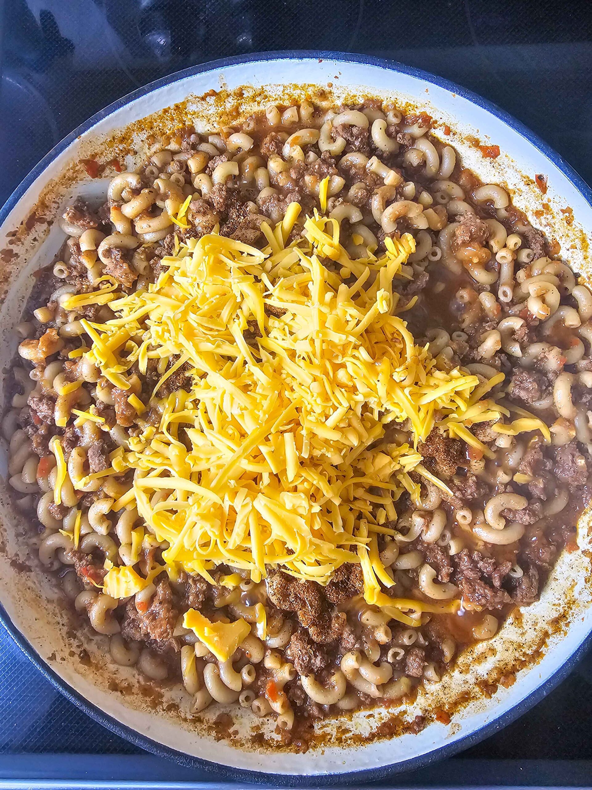 ADD SOUR CREAM AND CHEDDAR CHEESE