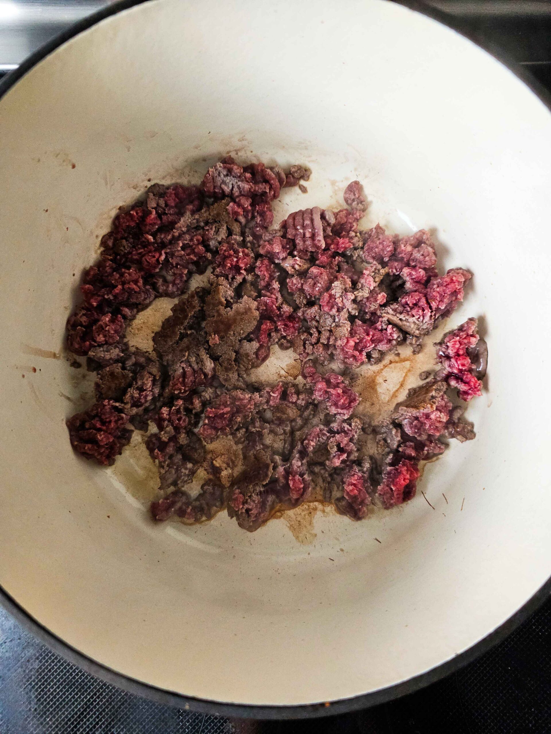 SAUTE THE GROUND BEEF AND DRAIN ANU EXCESS FAT