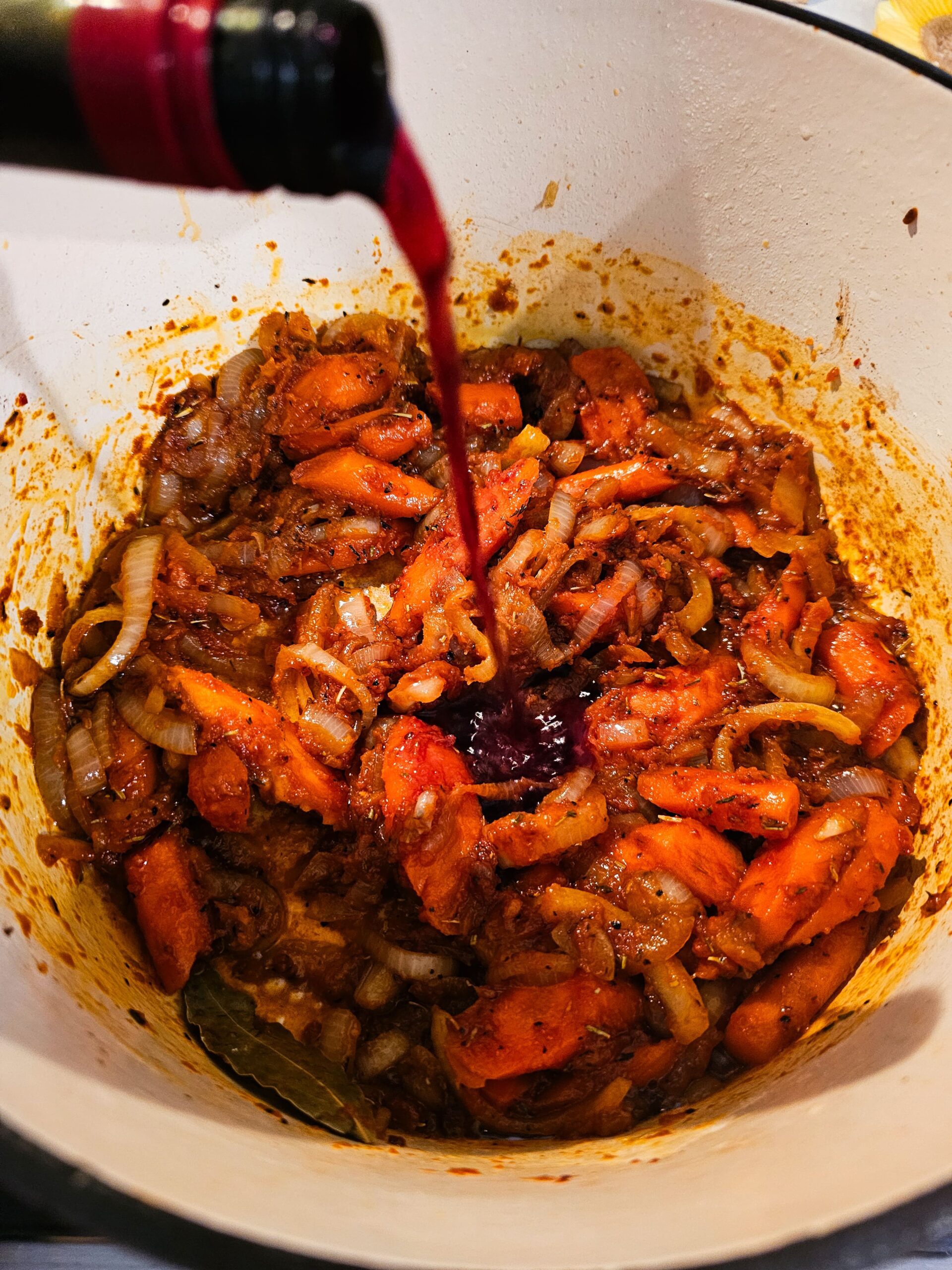 ADD THE RED WINE TO THE POT