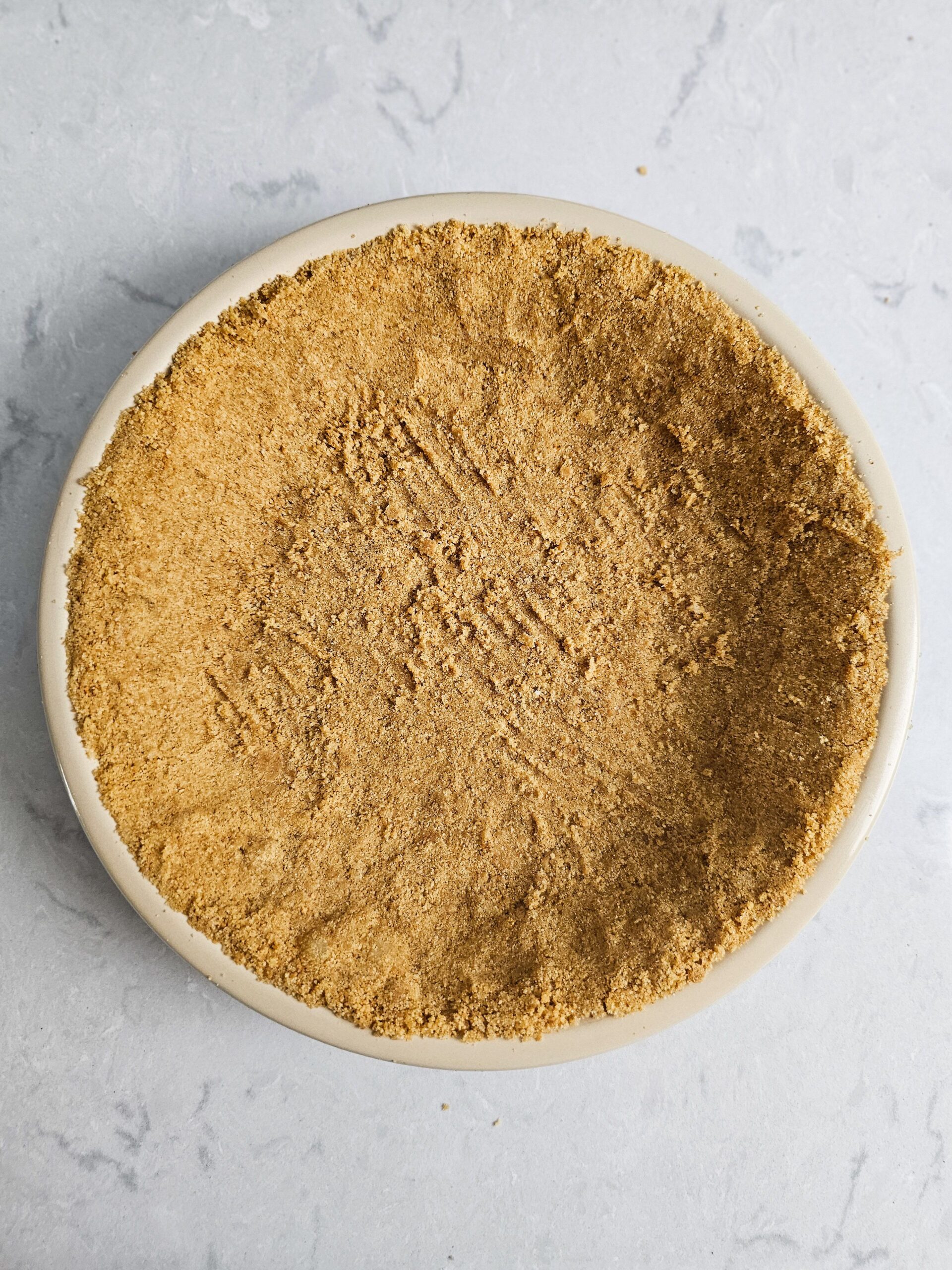 PRESS INTO PIE PAN AND BAKE FOR 10 MINUTES @ 350