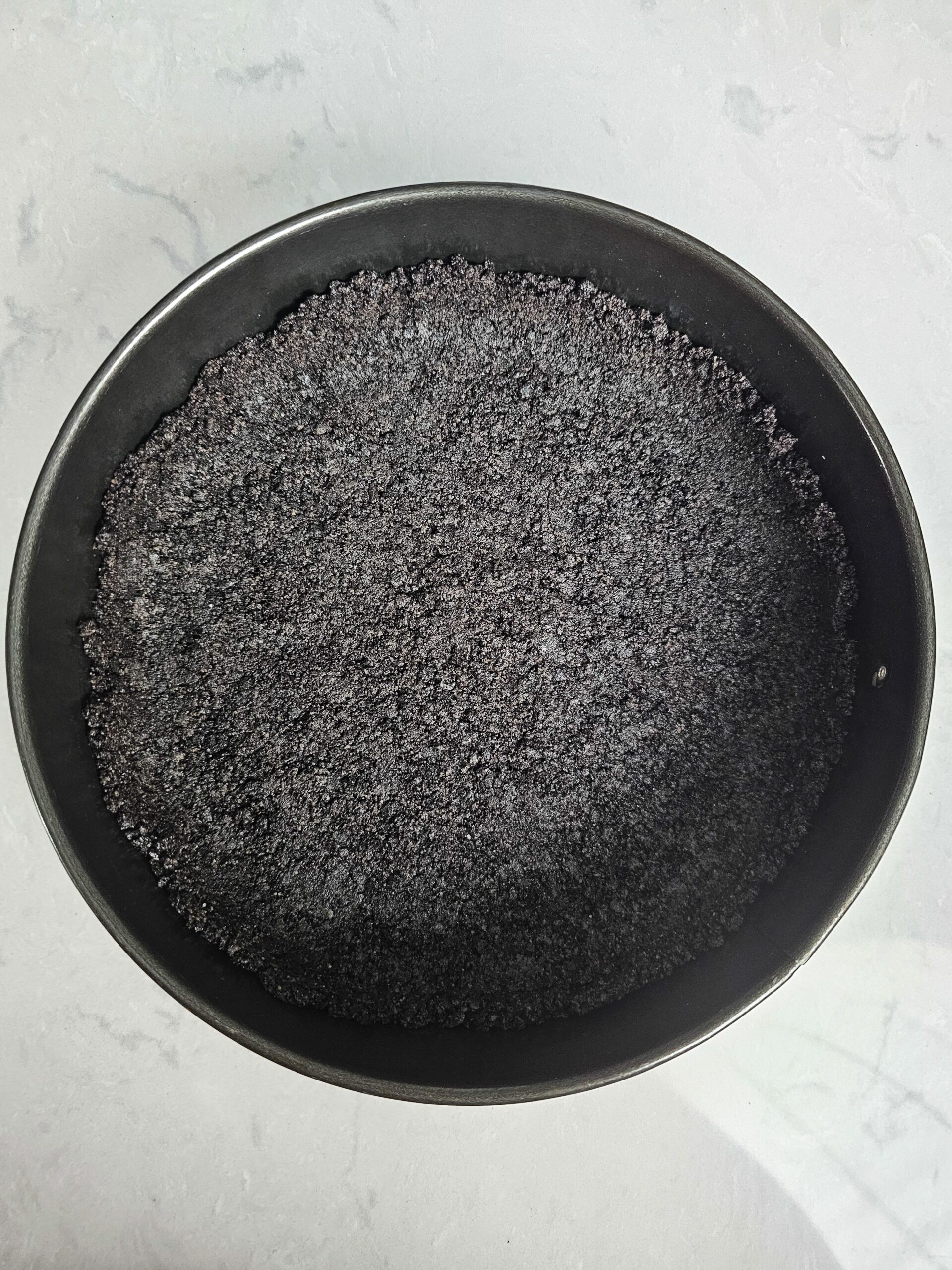 PRESS THE OREO COOKIE CRUST INTO A SPRINGFORM PAN