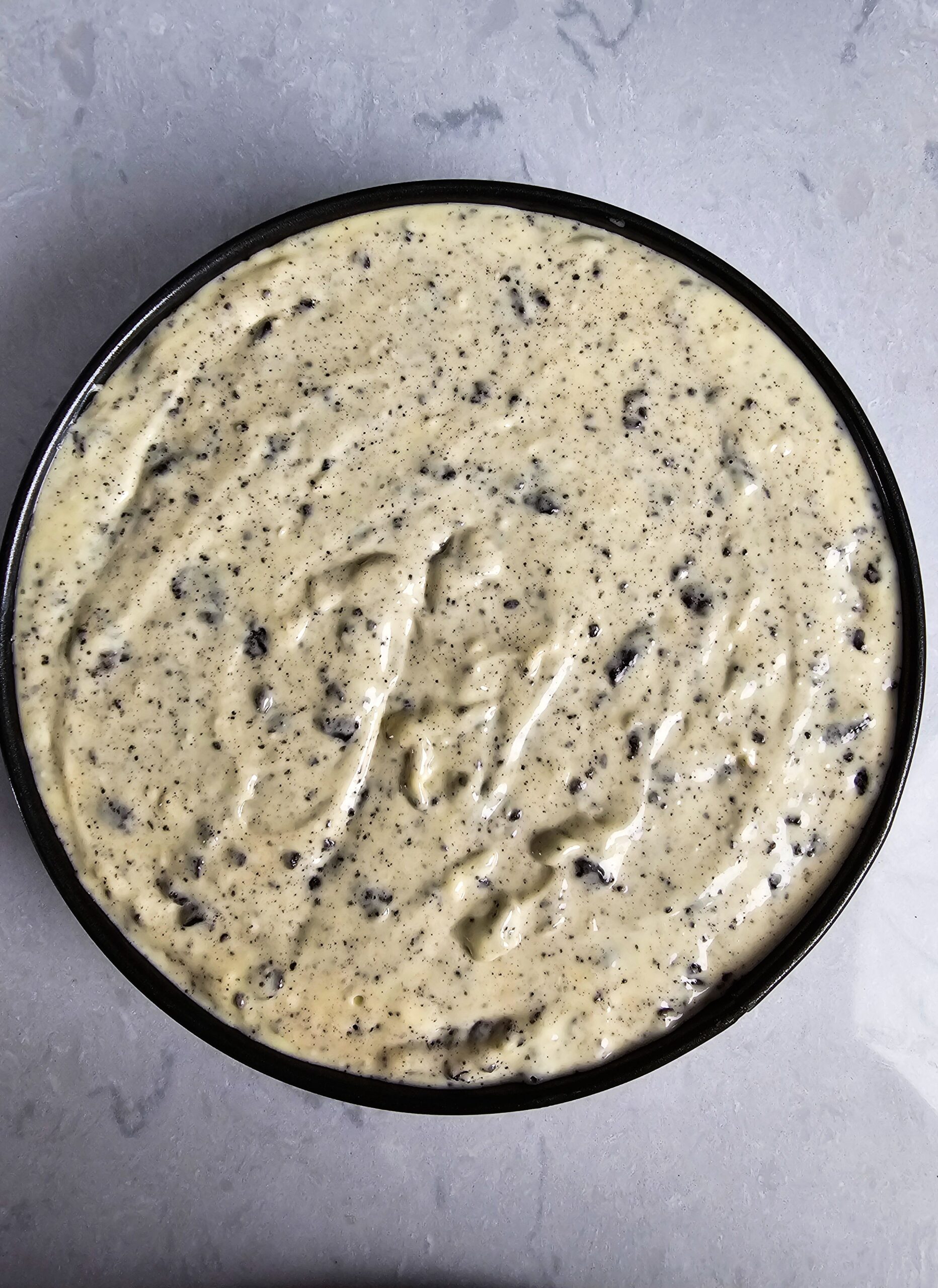 ASSEMBLE THE CHEESECAKE POU BATTER INTO THE SPRINGFORM PAN