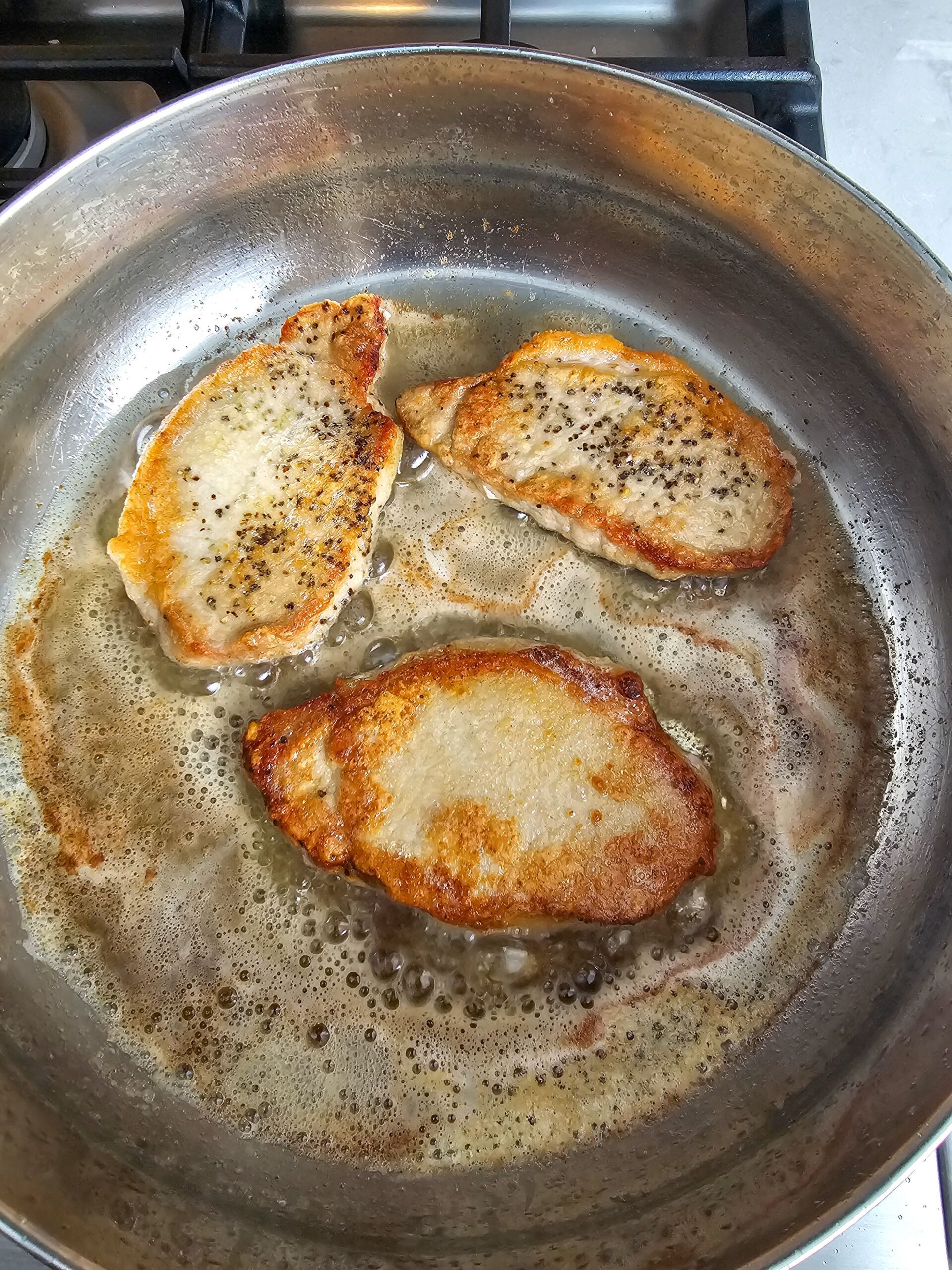 PORK LOIN CHOPS COOKED IN BUTTER AND OLIVE OIL