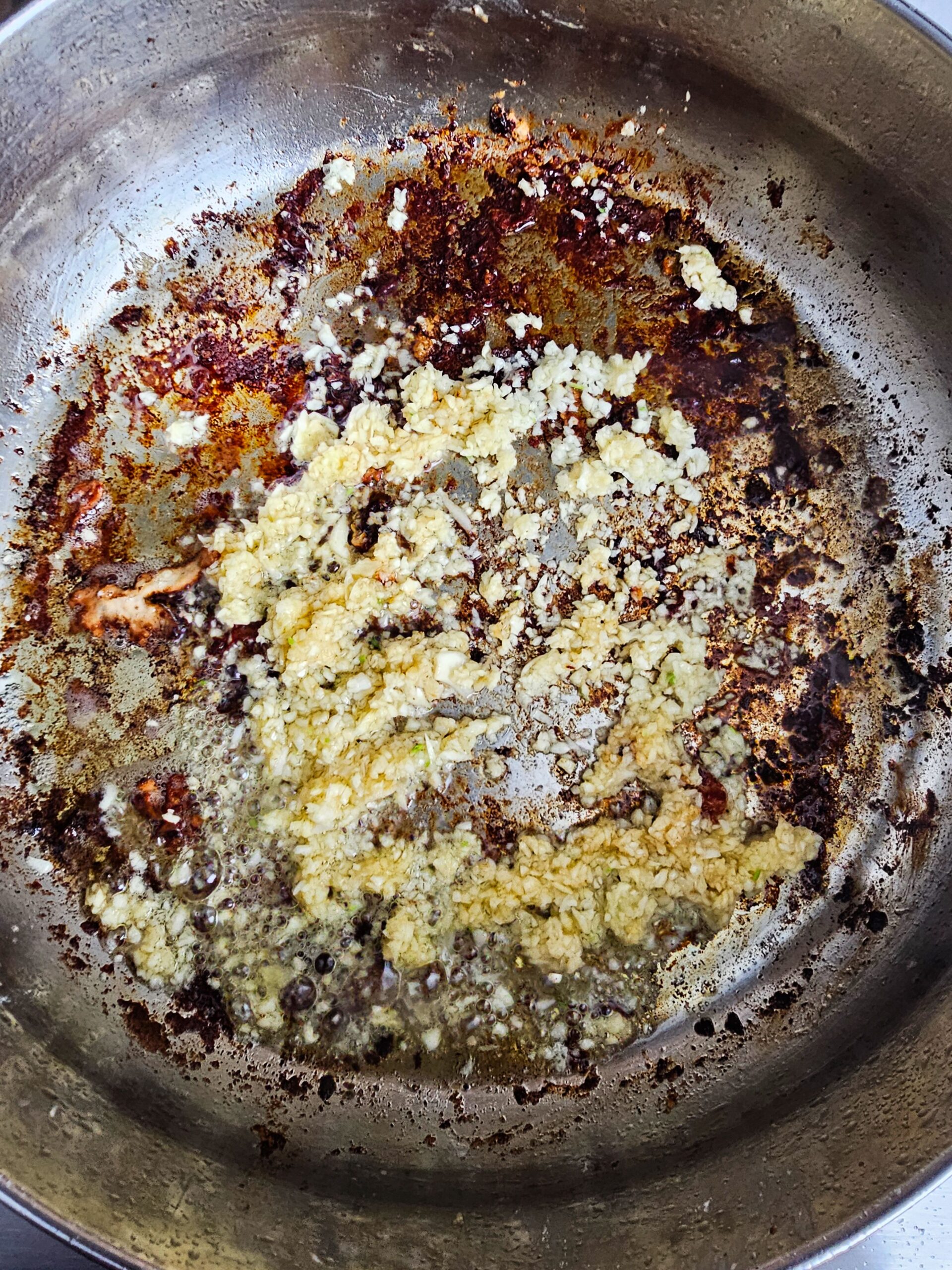 ADD THE GARLIC TO THE SAME PAN AND SAUTE THE GARLIC UNTIL FRAGANT