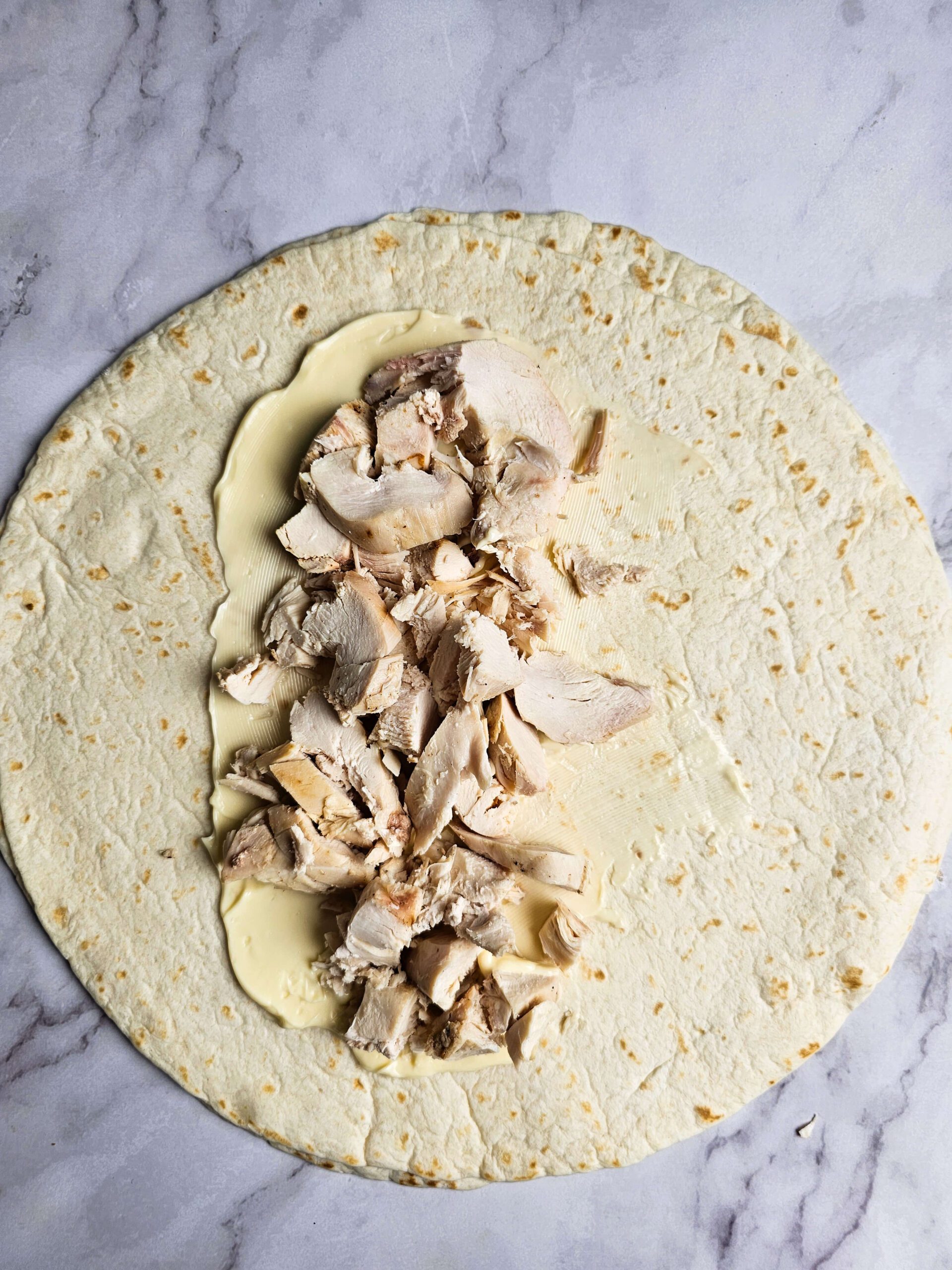 ADD THE TURKEY TO THE TORTILLA