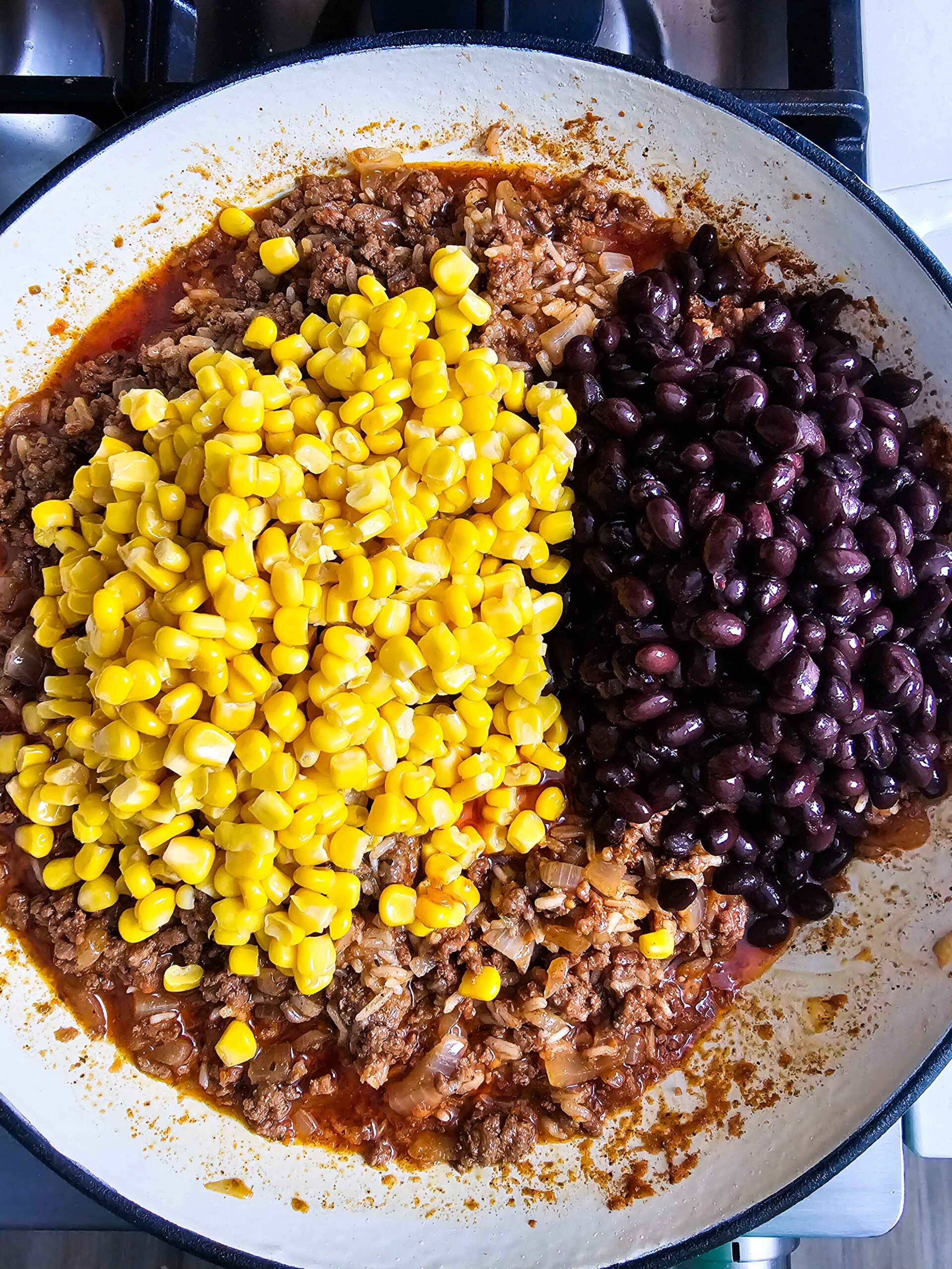 ADD THE CORN AND THE BLACK BEANS