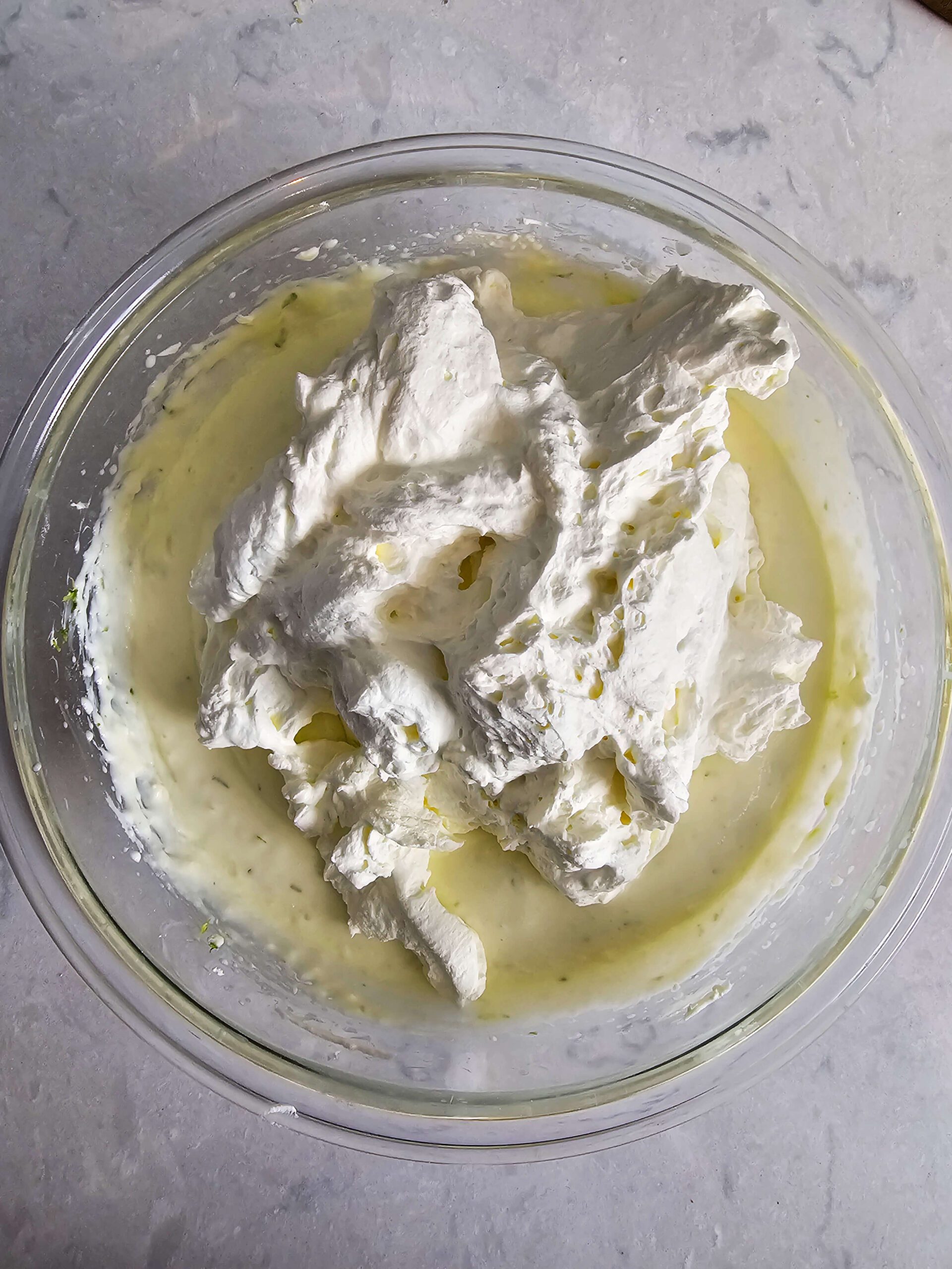 FOLD IN THE WHIPPED CREAM INTO THE CREAM CHEESE MIXTURE