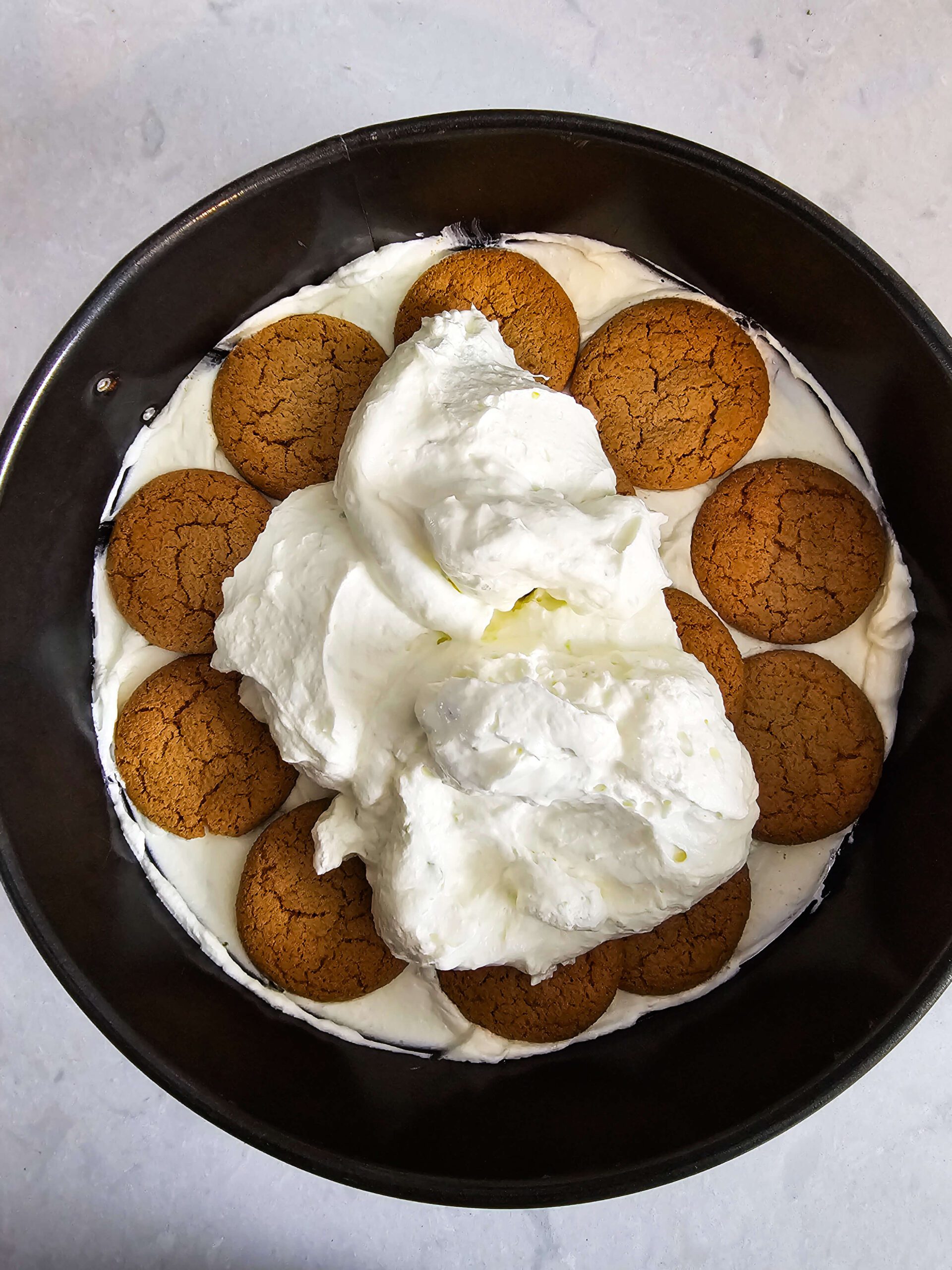 LAYER THE CREAM AND COOKIES INTO THE SPRINGFORM PAN
