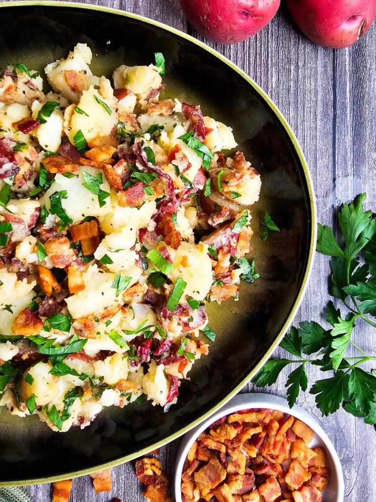 Warm German Potato Salad (No Mayo or Eggs)  up close oval platter
