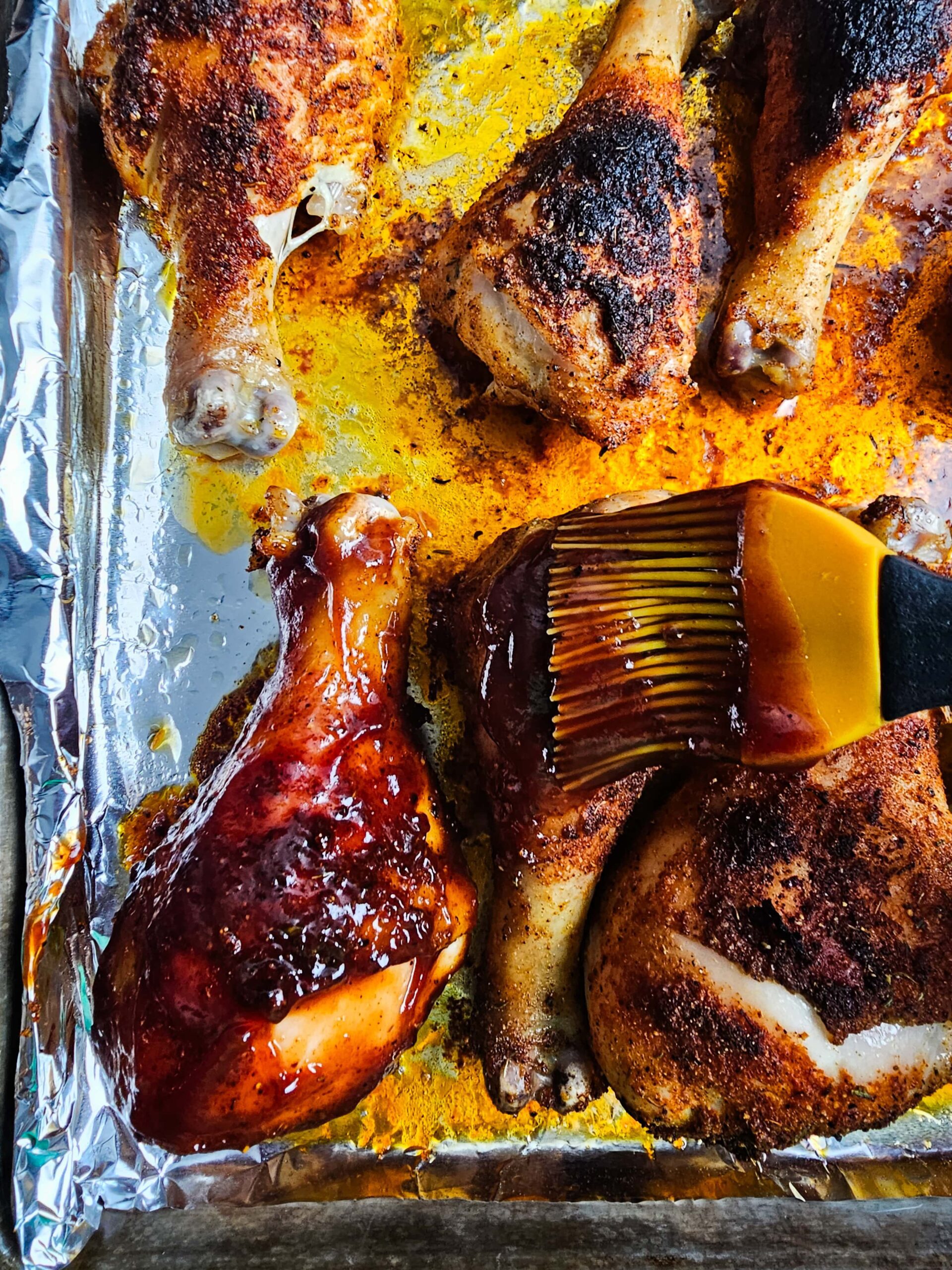 BRUSH ON THE BBQ SAUCE ONTO THE DRUMSTICKS