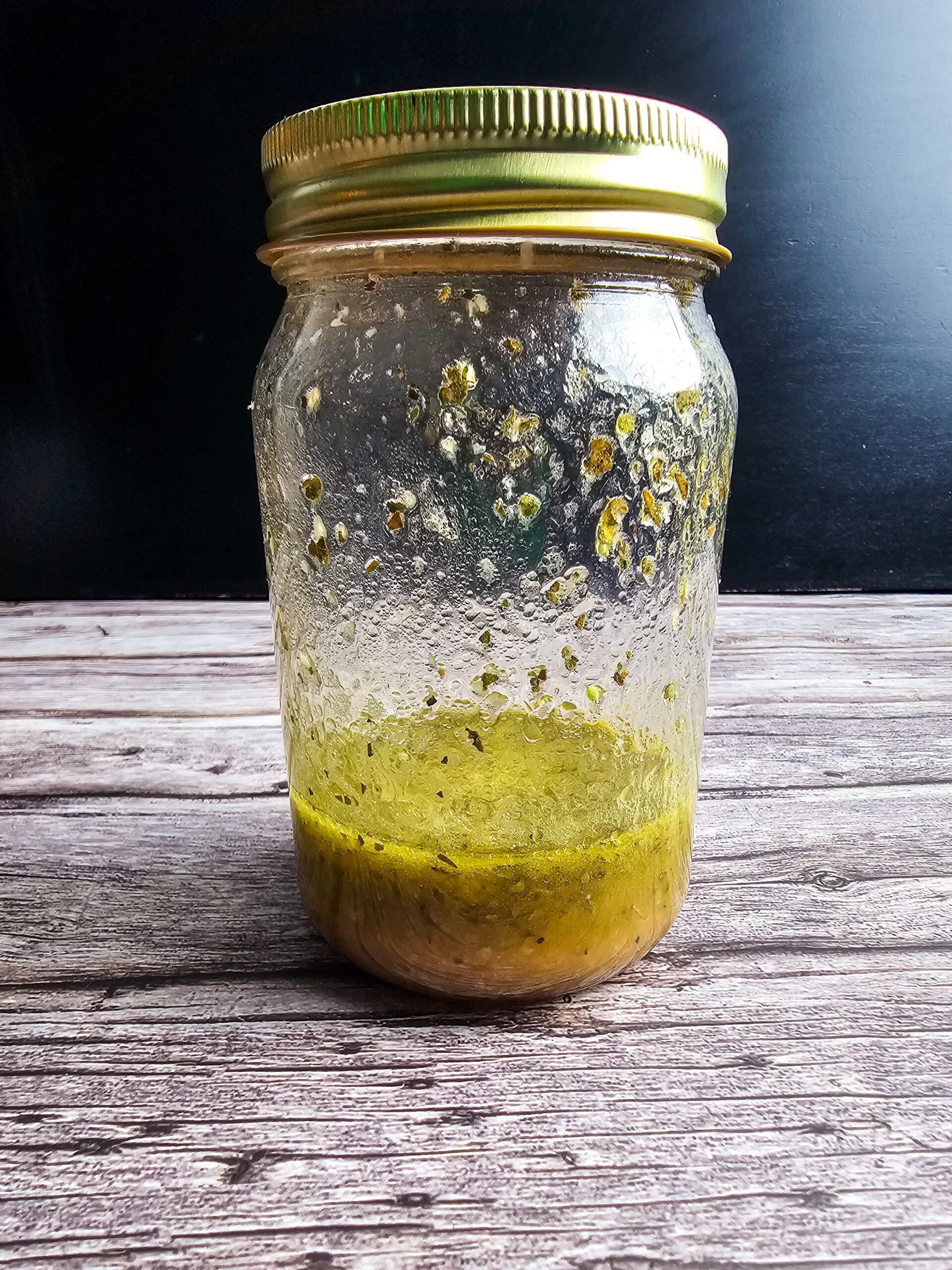 ADD THE OLIVE OIL AND RED WINE VINEGAR TO A JAR OR SMALL BOWEL AND COMBINE