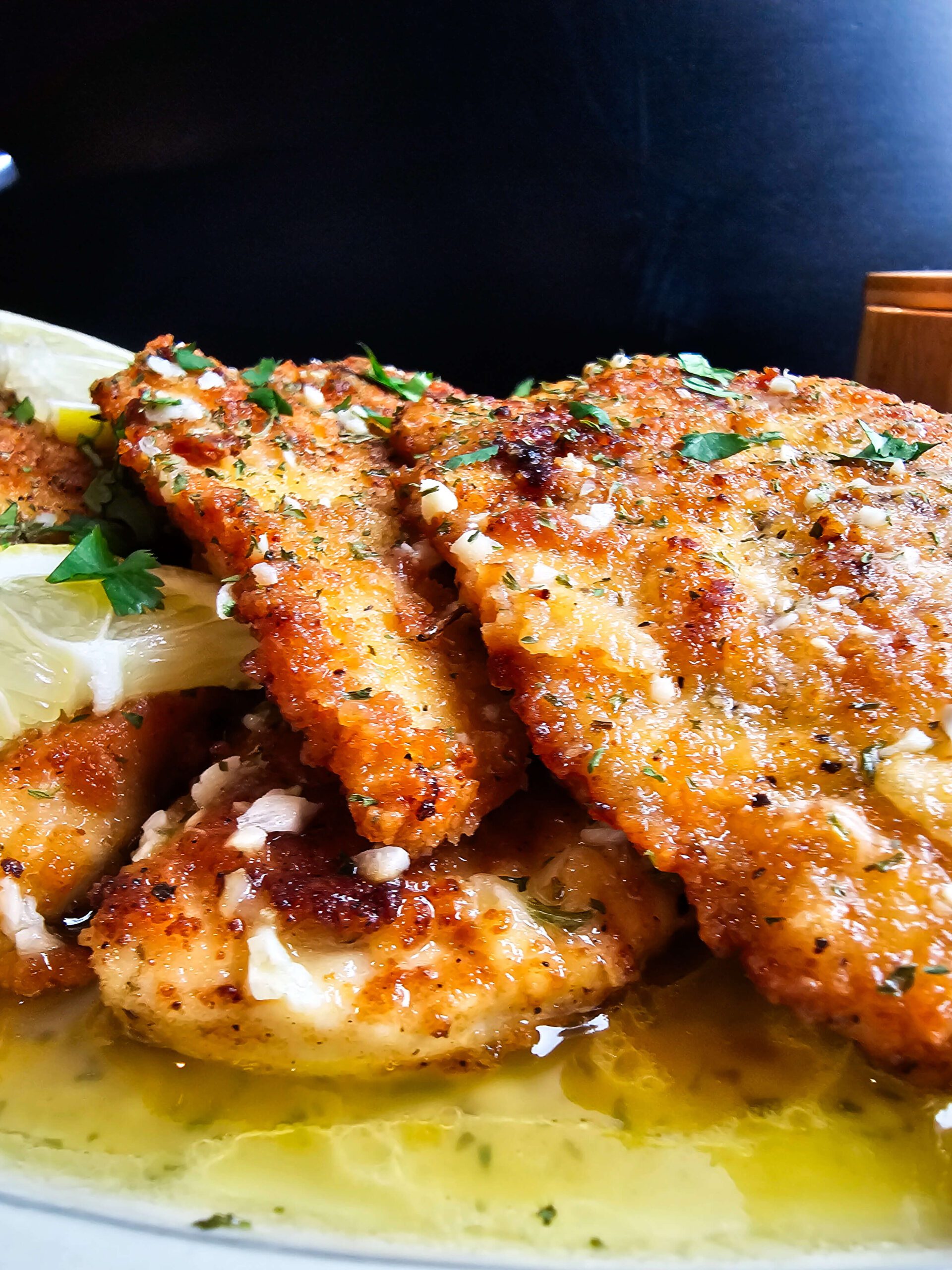 POUR THE LEMON BUTTER SAUCE OVER THE GOLDEN BROWN CHICKEN AND SERVE