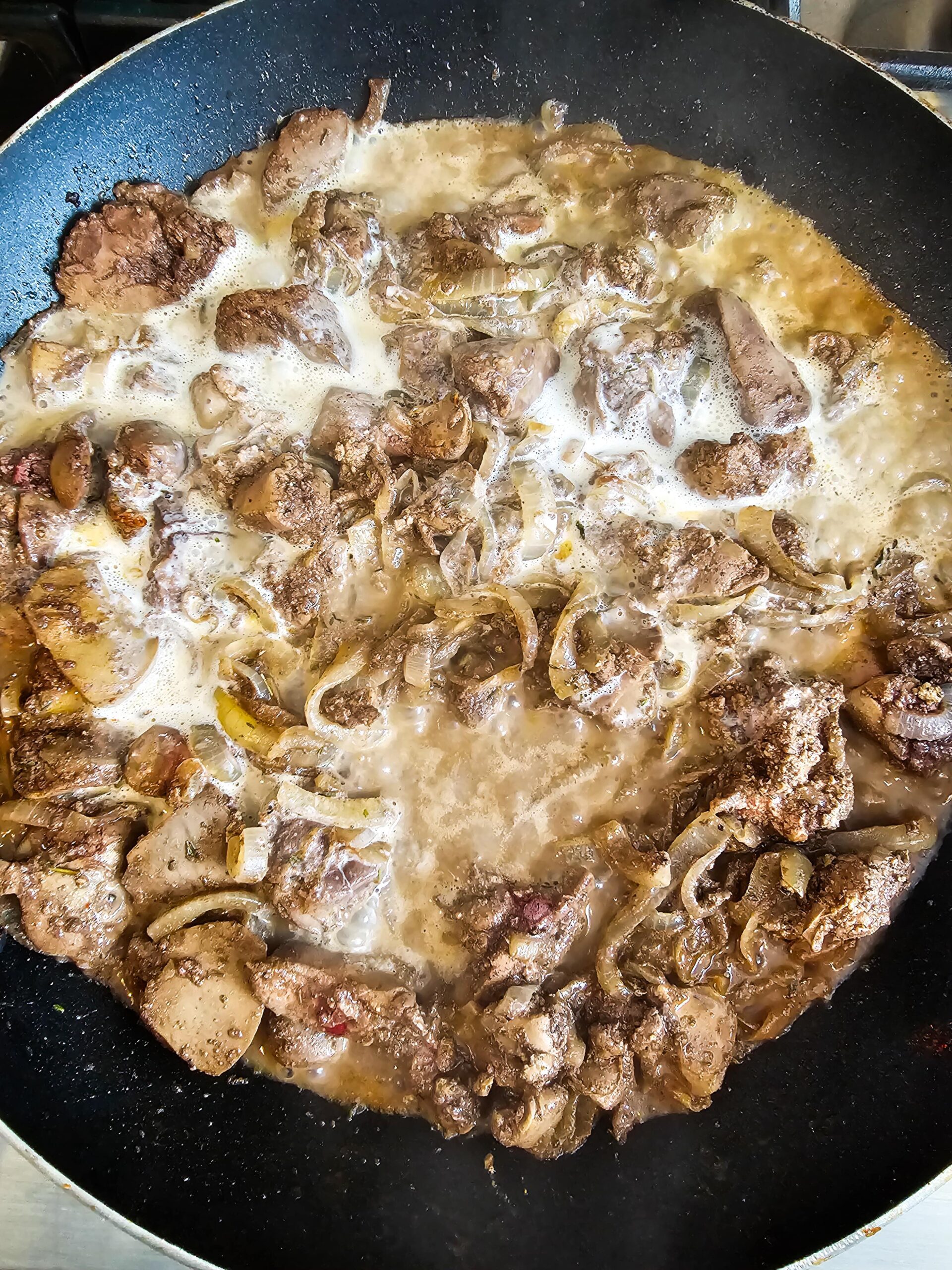 ADD THE SEASONING AND THE WINE AND CREAM INGREDIENT TO THE SKILLET