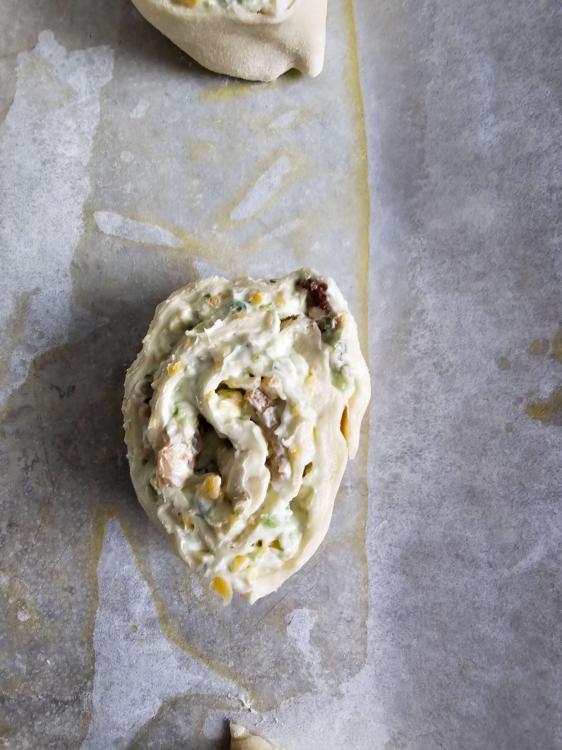 BRUSH EACH PINWHEEL WITH THE EGG WASH TO GET THAT GOLDEN COLOR