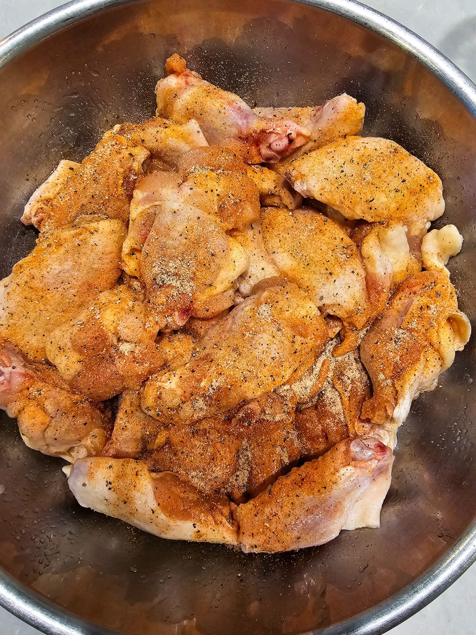 TOSS THE AVOCADO OIL AND SPICE RUB ALL OVER THE WINGS