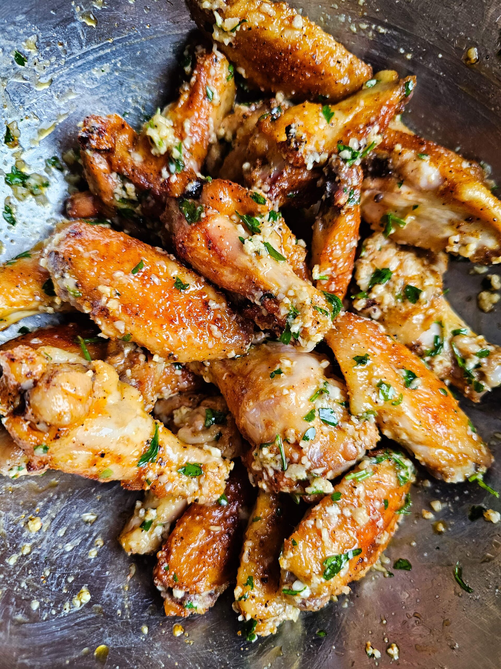 TOSS THE SAUCE AND THE WINGS TOGETHER IN A LARGE MIXING BOWL