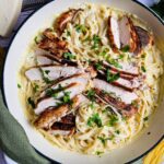 LARGE CAST ENAMAL SKILLET FULL OF CREAMY CHICKEN FETUCCINI PASTA